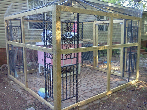 Our chicken coop/run with the hen house inside. Yes, that is a pink hen house :) My daughter picked the color. Right now it's being used as a brooder for our babies.