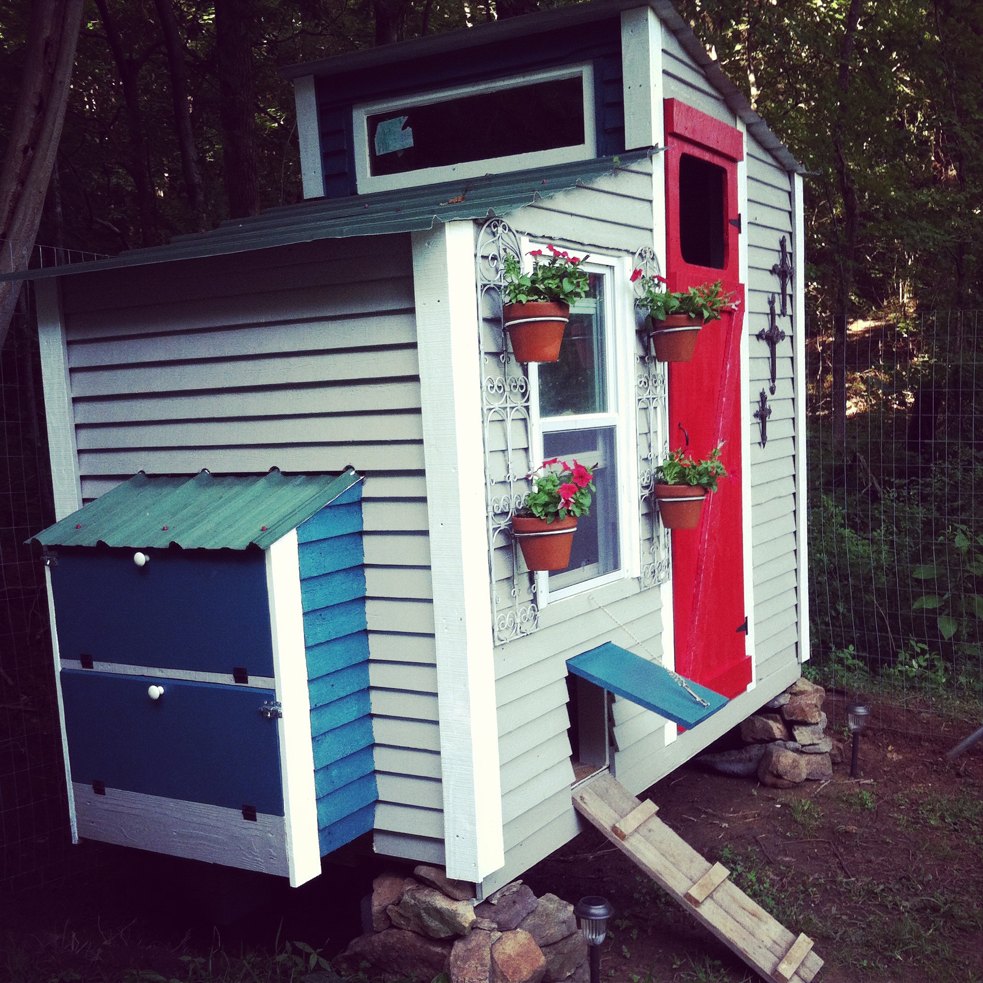Our Chicken Coop.  We used pallet wood and some salvage materials.