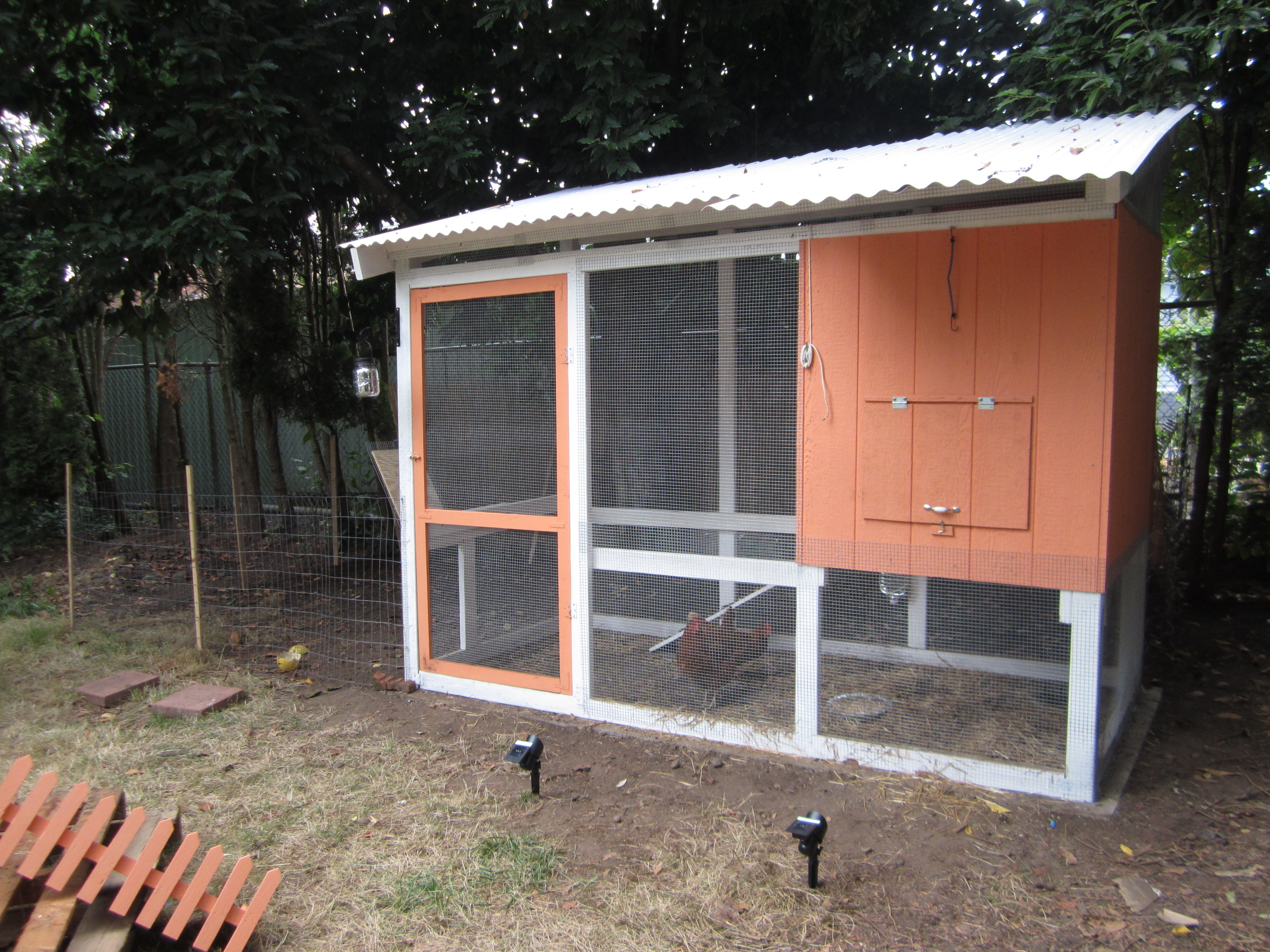 Our coop and attached run. We have nest boxes inside with an access door at the front.