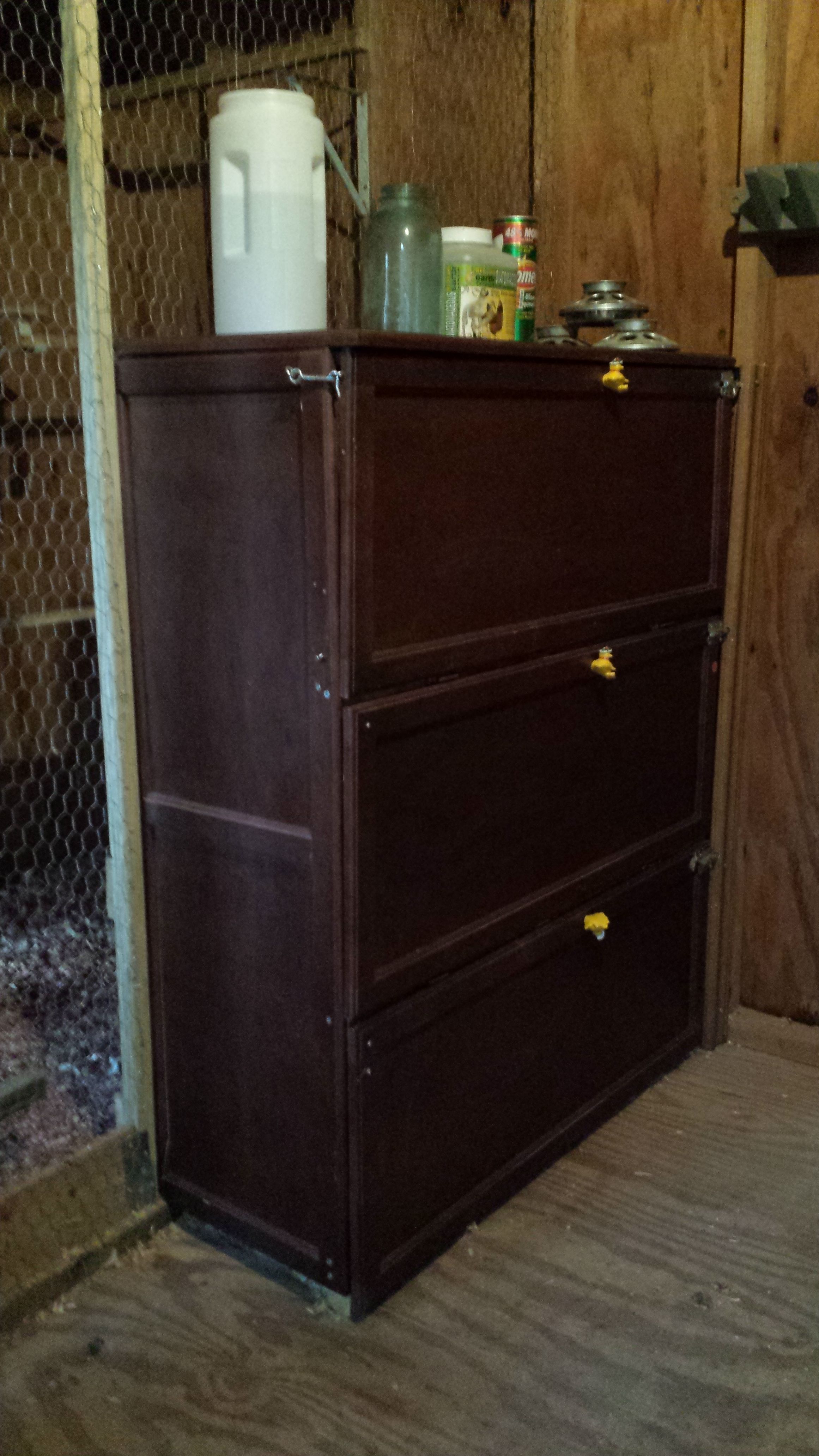Our egg cabinet that houses 12 nesting baskets--the wooden panels were purchased for $1 each at Habitat Restore--assembled with additional supports and screws--minimal effort--adding hinges.  The front is open for access.  The baskets were from the Dollar Store.