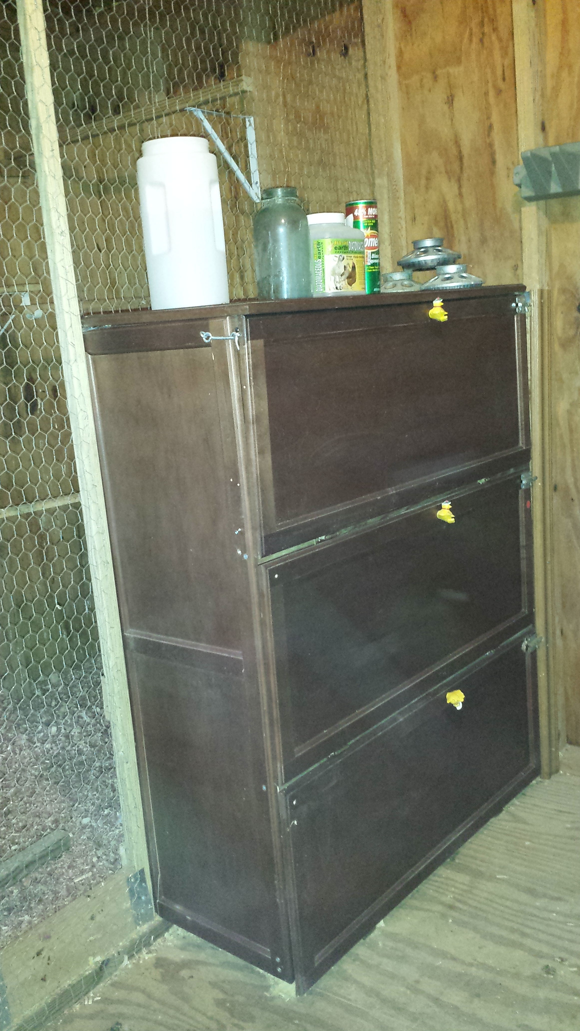 Our egg cabinet that houses 12 nesting baskets--the wooden panels were purchased for $1 each at Habitat Restore--assembled with additional supports and screws--minimal effort--adding hinges.  The front is open for access.  The baskets were from the Dollar Store.