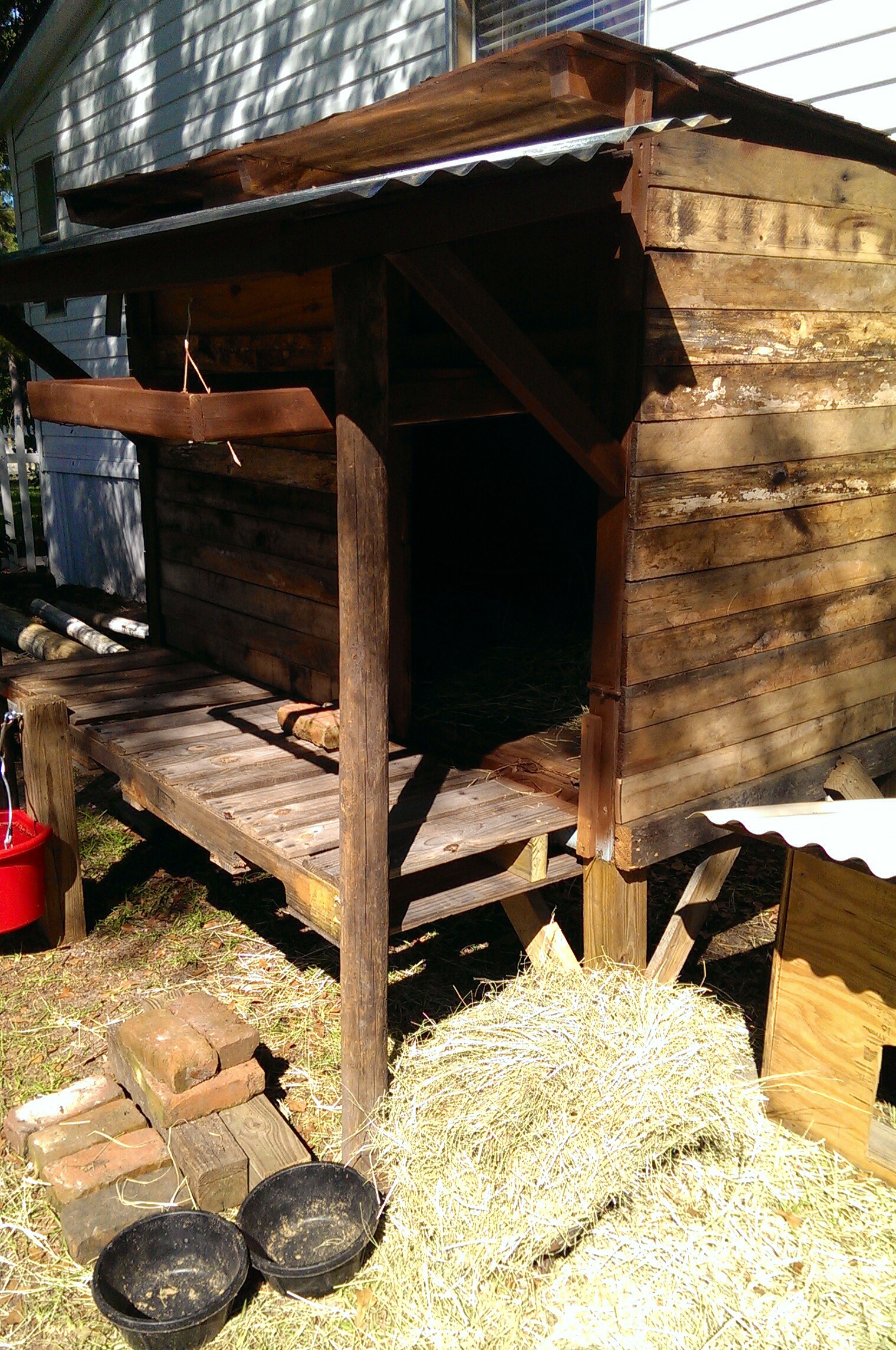 Our new Goat House we made using old pallets and scrap wood. Total cost $20.00 for metal roofing.