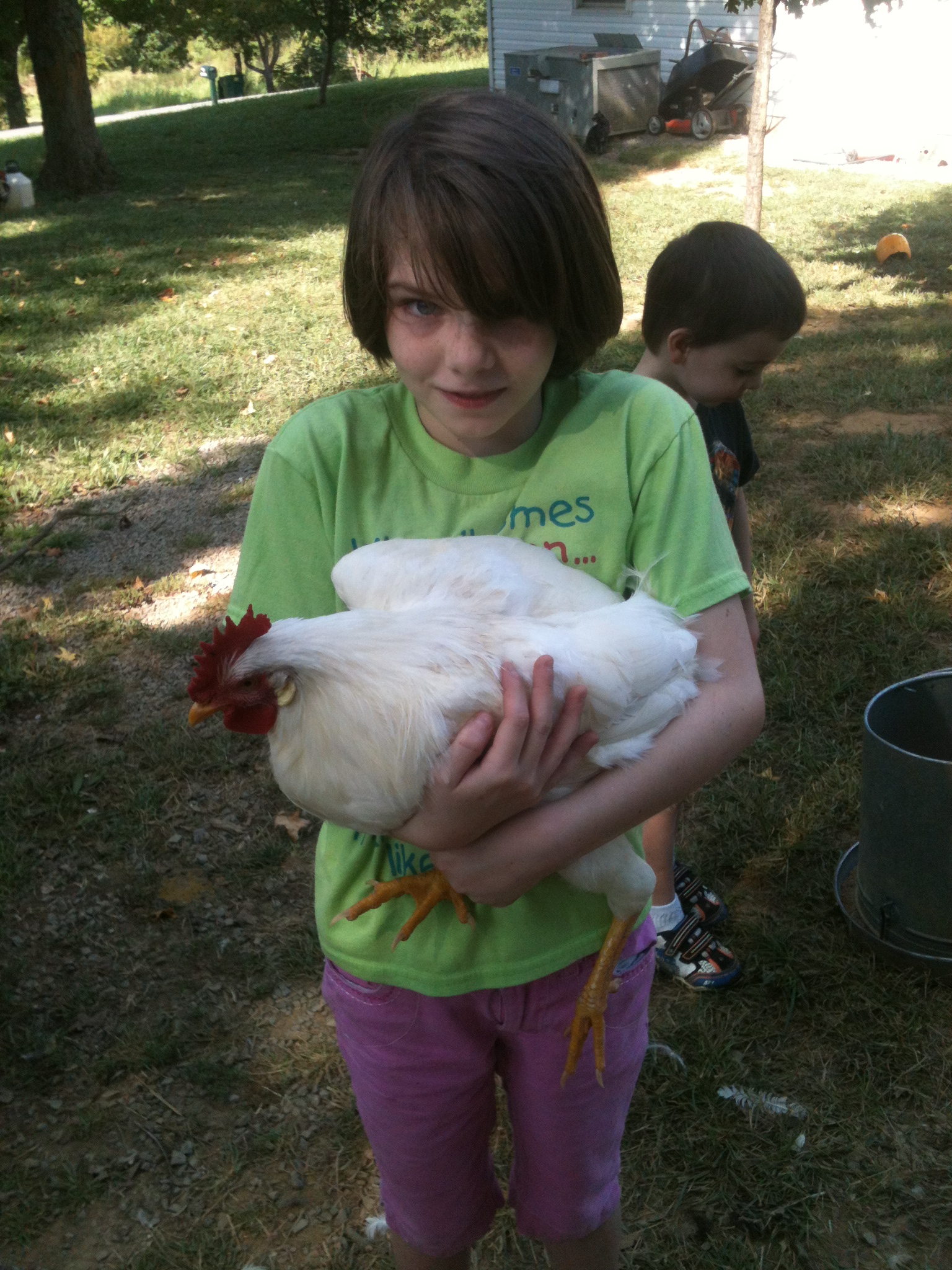 Our oldest, holding a friend's hen while we were picking up our girls