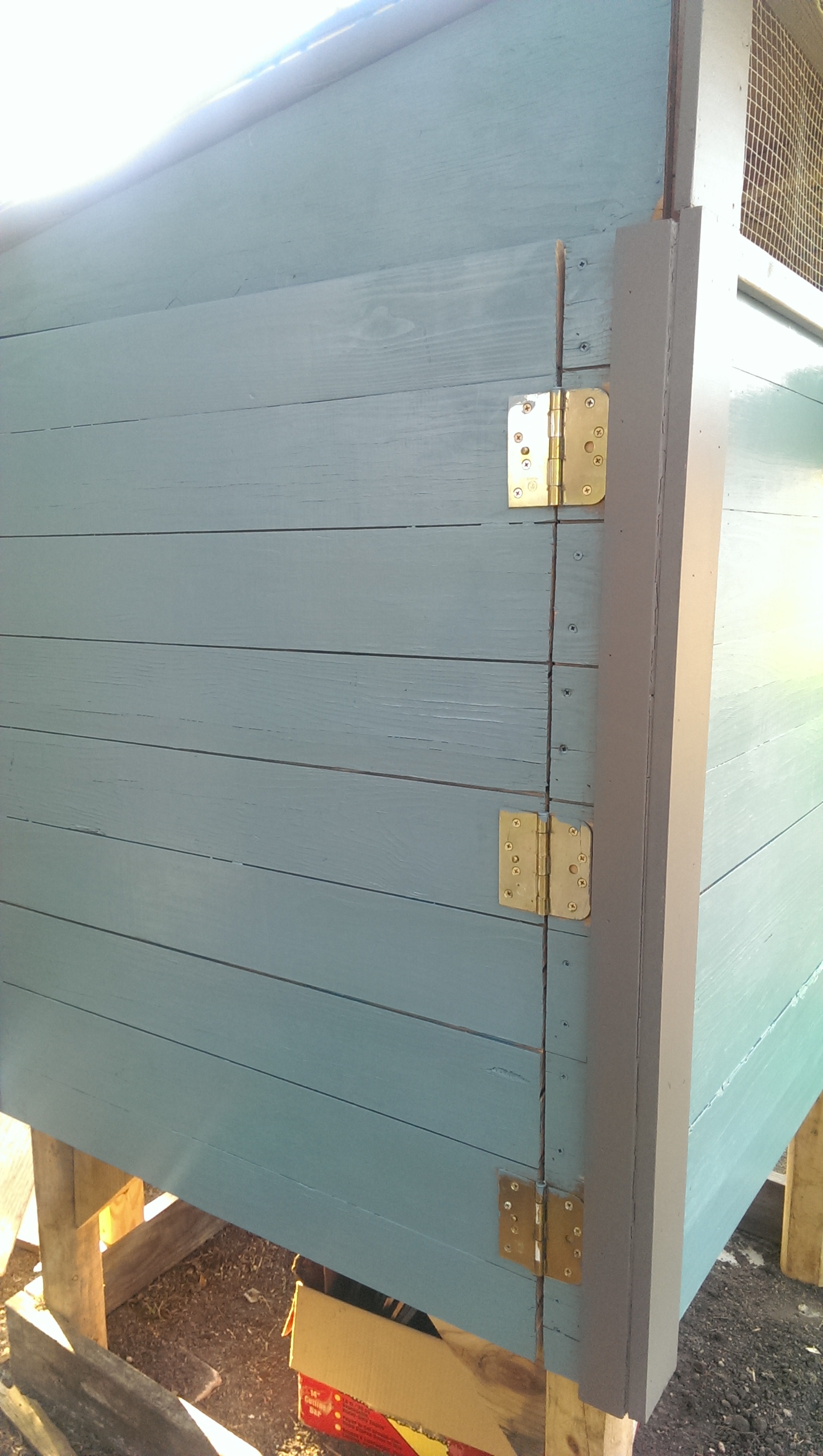 Our paint job getting started, this is the "oops" paint from home depot that I got for five bucks it was a Behr exterior with primer paint in the color "Midnight in Paris"...or what my hubby calls gray-blue