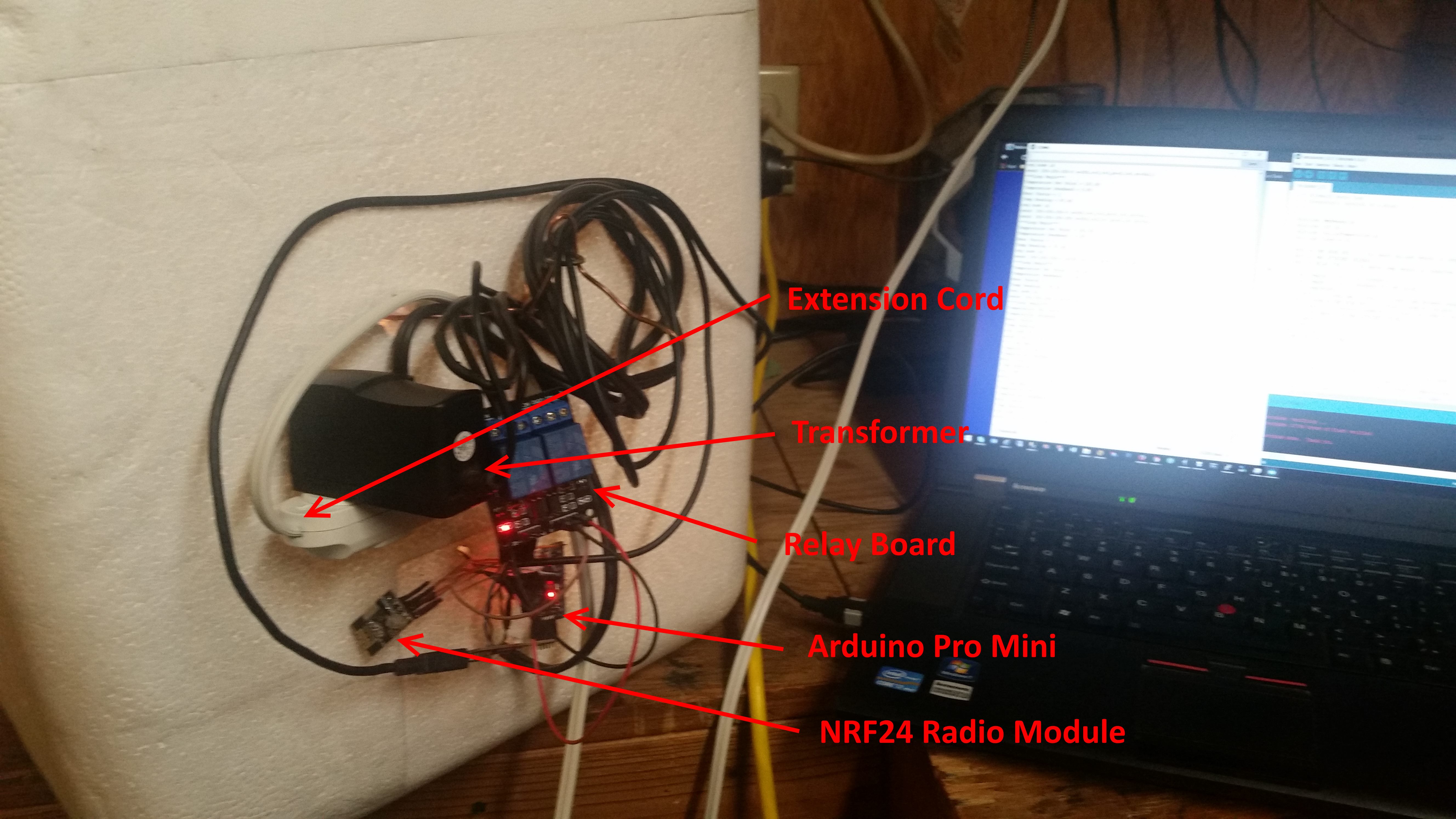 Outside of DIY incubator. Arduino Pro Mini, NRF24L radio module, relay board, old cell phone wall wart to supply everything but the light bulb. The extension cord powers the whole system.