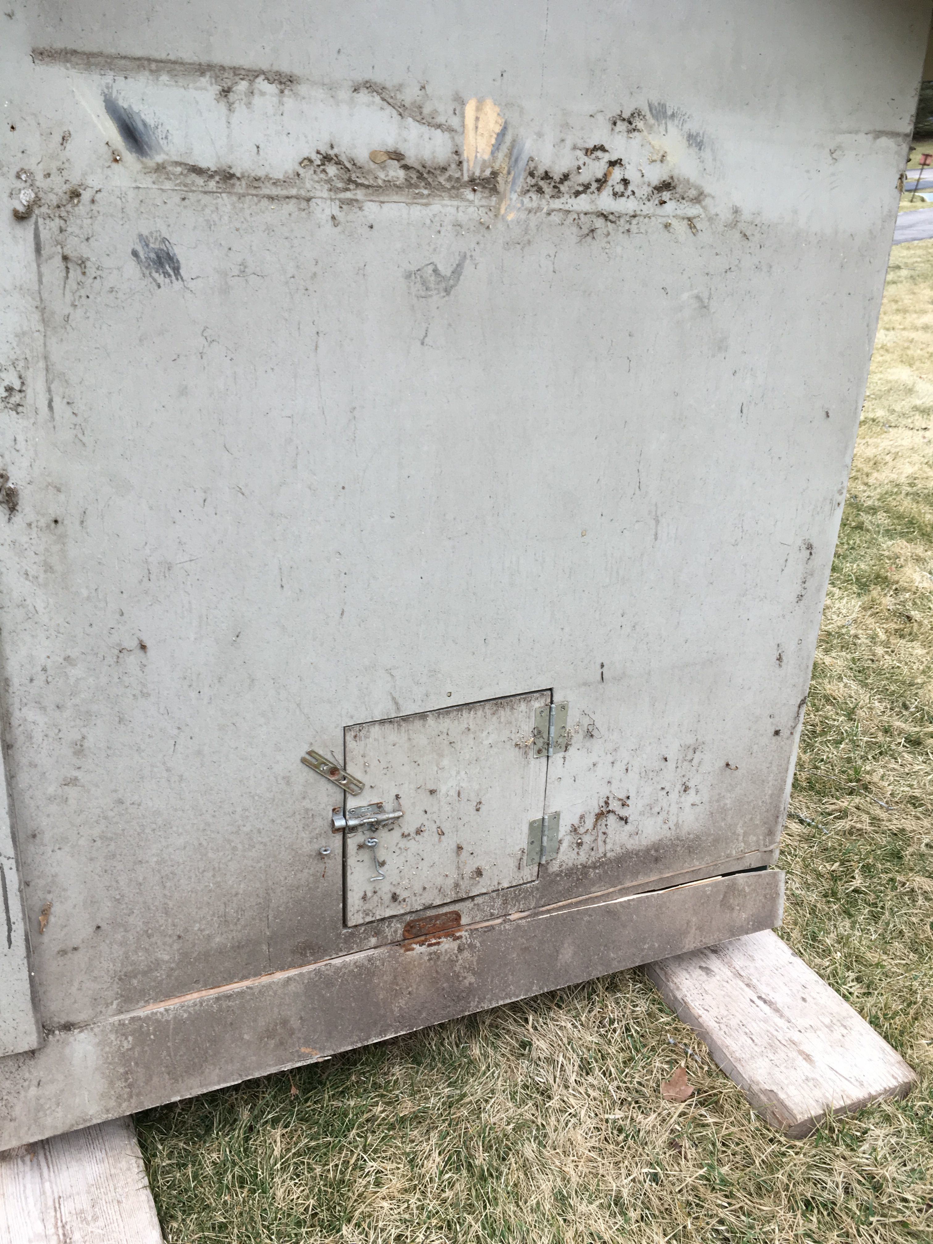 Outside view of pop door.  We also received a chicken run (9'x8') that also needs a lot of work (not shown).  I'd also like to paint the exterior, but I'm running out of time.