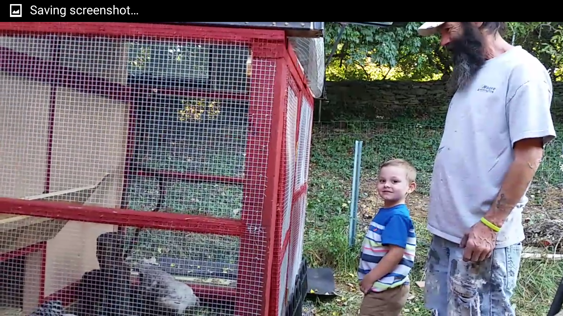 Papaw and Brandon watching the new chickens