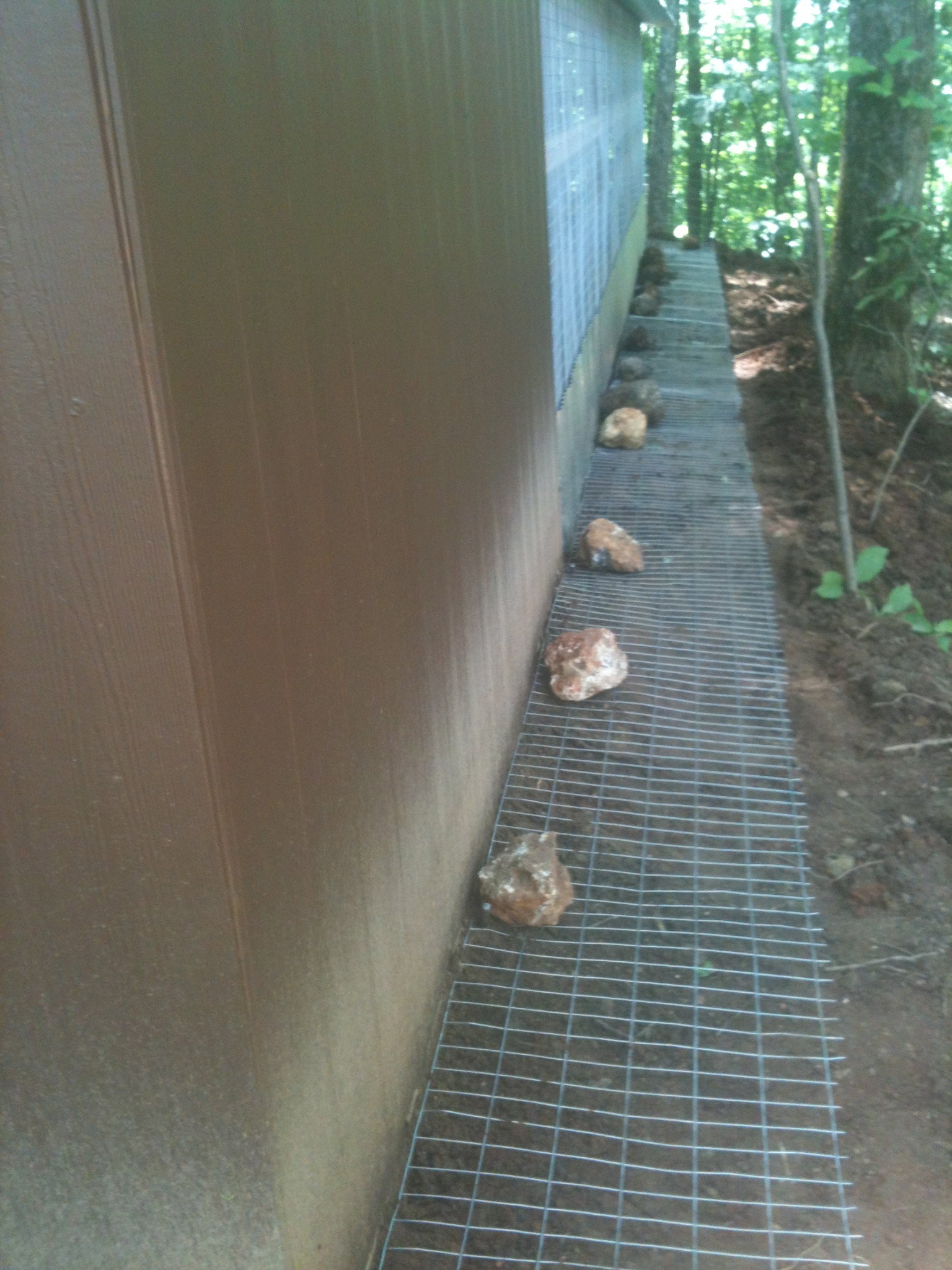 predator wire staked and covered by a foot of back fill