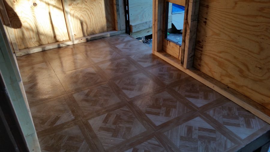 put down the cheap stick on tile for easy clean up