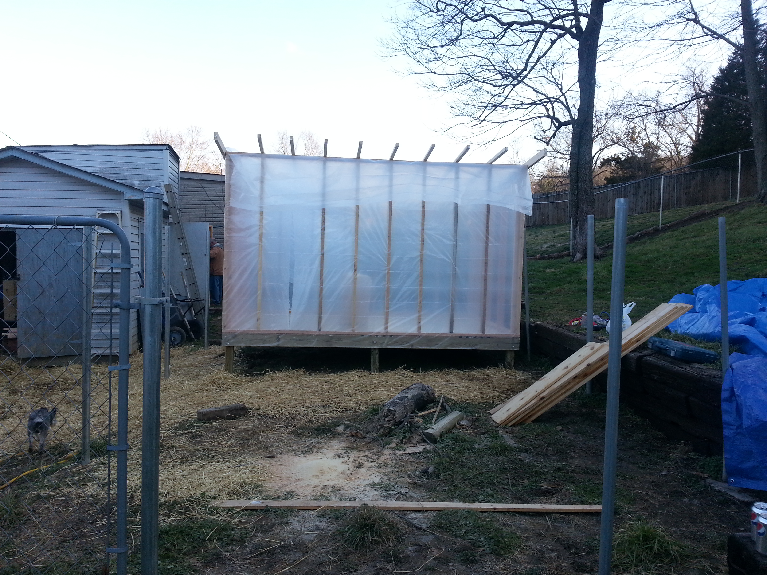 Put up a moisture barrier all around the frame tacking with a hammer stapler.