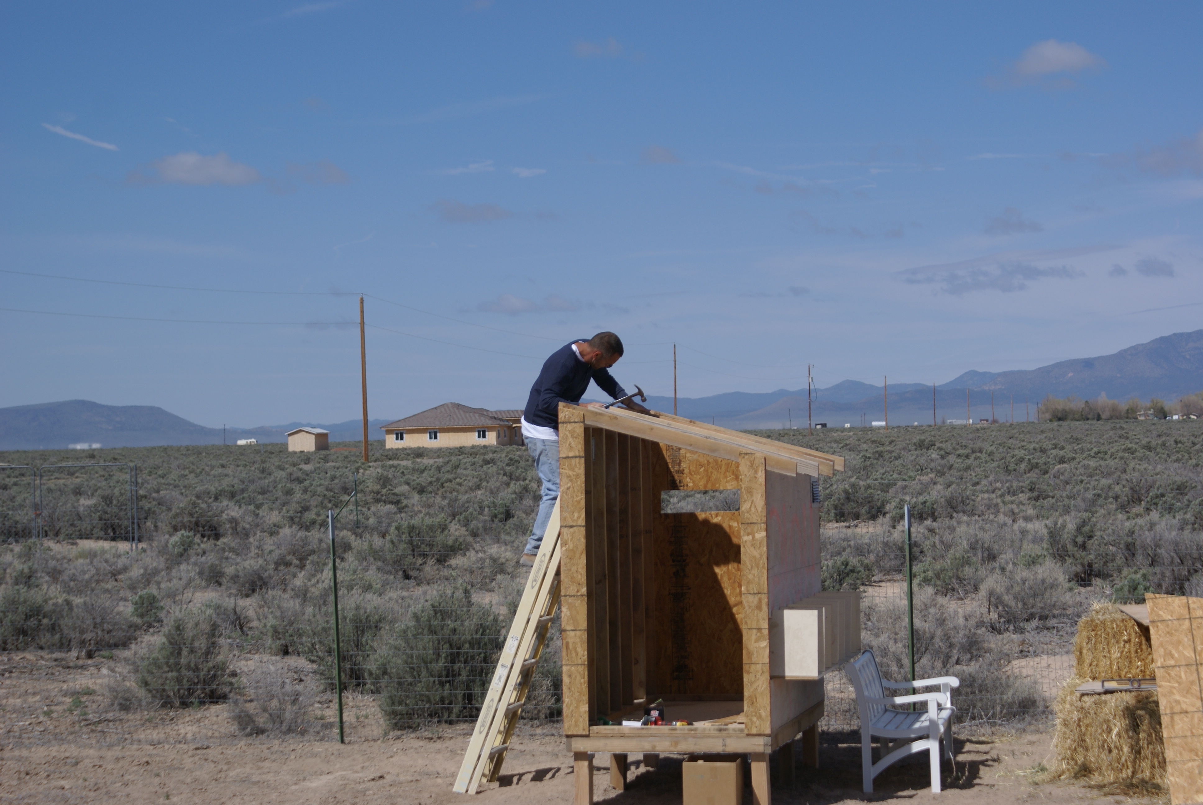 Putting on the rafters then the roof.