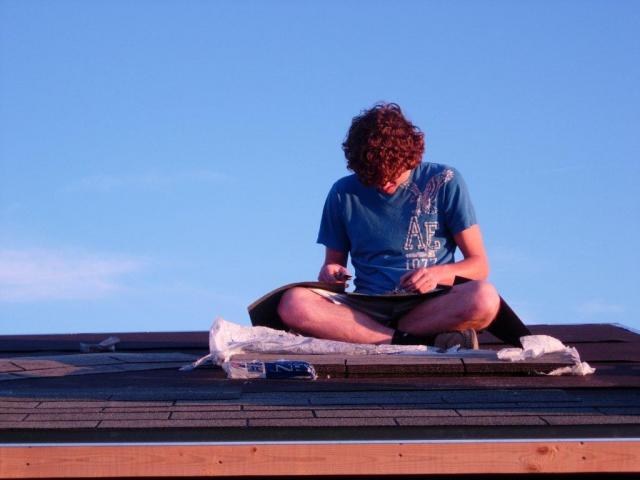 Putting on the roof - had one of my son's friends help us with this project.