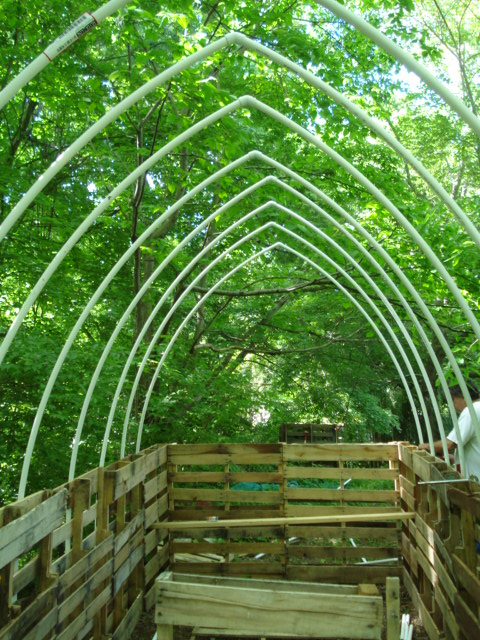 pvc pipe mounted on sides of pallets with brackets