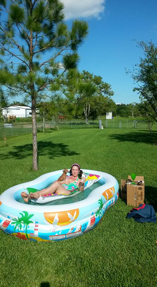 Relaxing and thinking about chicken possibilities for the back yard.  See the gate in the back.  All that land out there needs chickens!