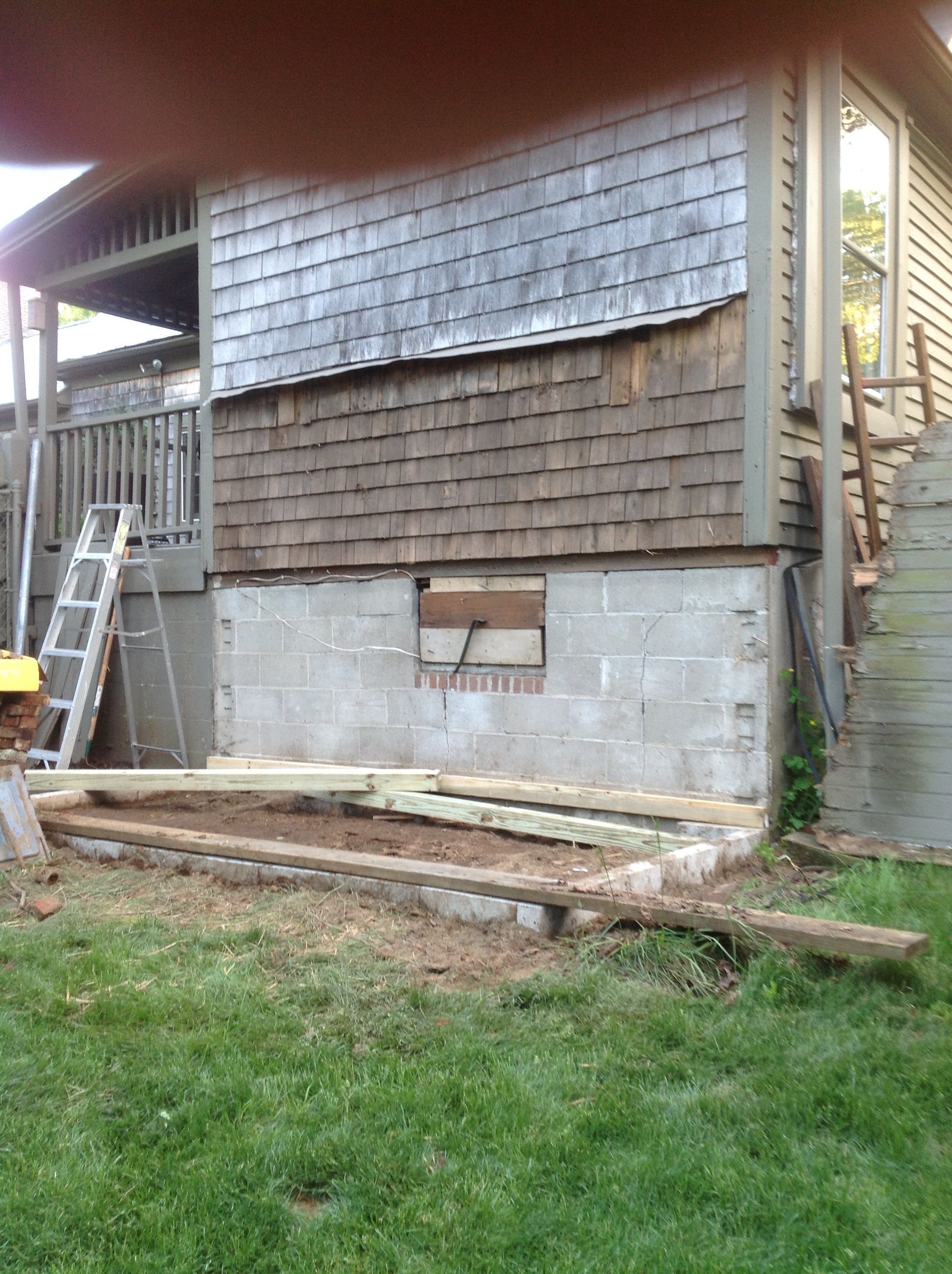 Removed existing housing with collapsed roof.  2x4x8 pavers set on side for foundation, pressure treated lumber on botton.  Unable to salvage the old structure...but the old barn wood will be recycled into many new projects.