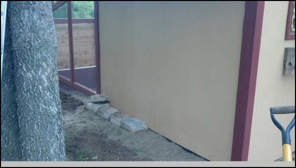 Rock border. Going to install a window above where the rocks are currently. Need to get light and ventilation into the breeder area