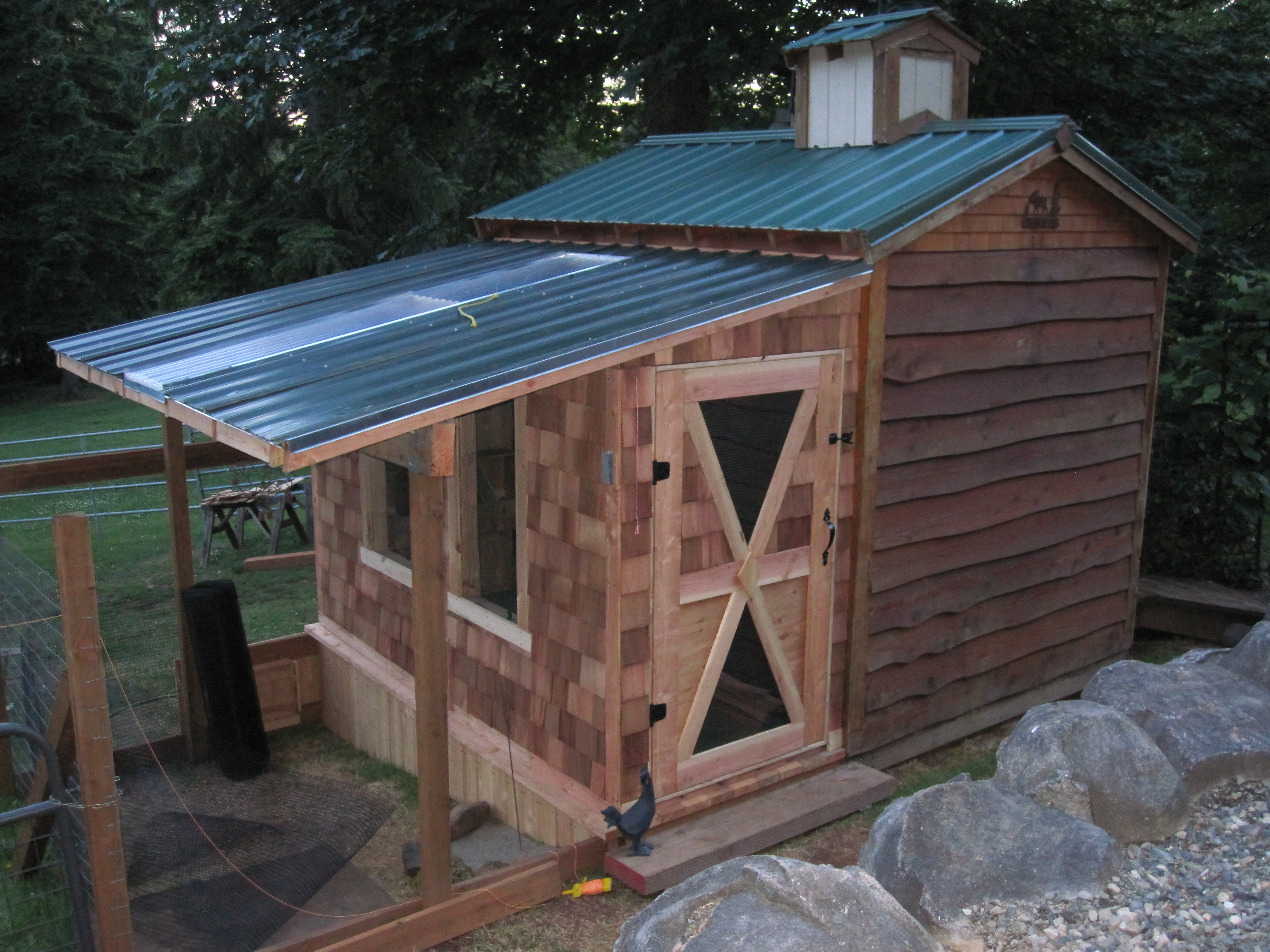 Roof, complete with sky light. Door, out of shingles (again lol), and sand pit.