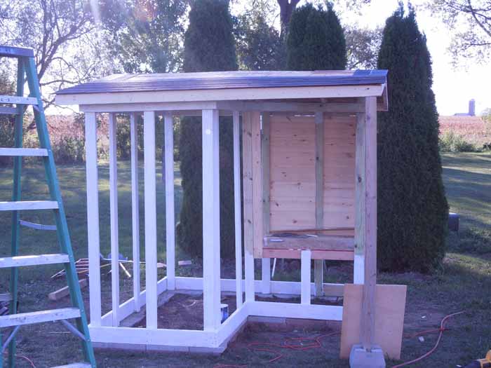 Roof done, coop started and primer going on.