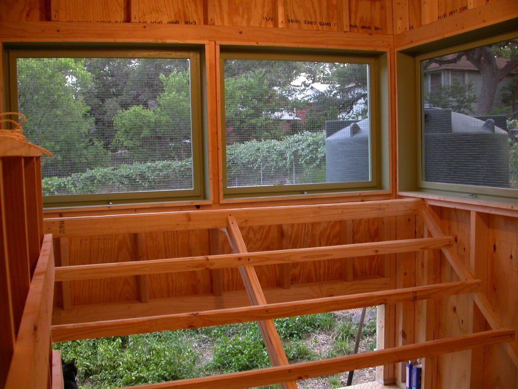 Roosts and windows on the south side. The windows are screened with 1/2" hardware cloth and black metal screening cloth.