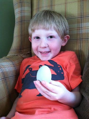 Rowan with his chicken's first egg