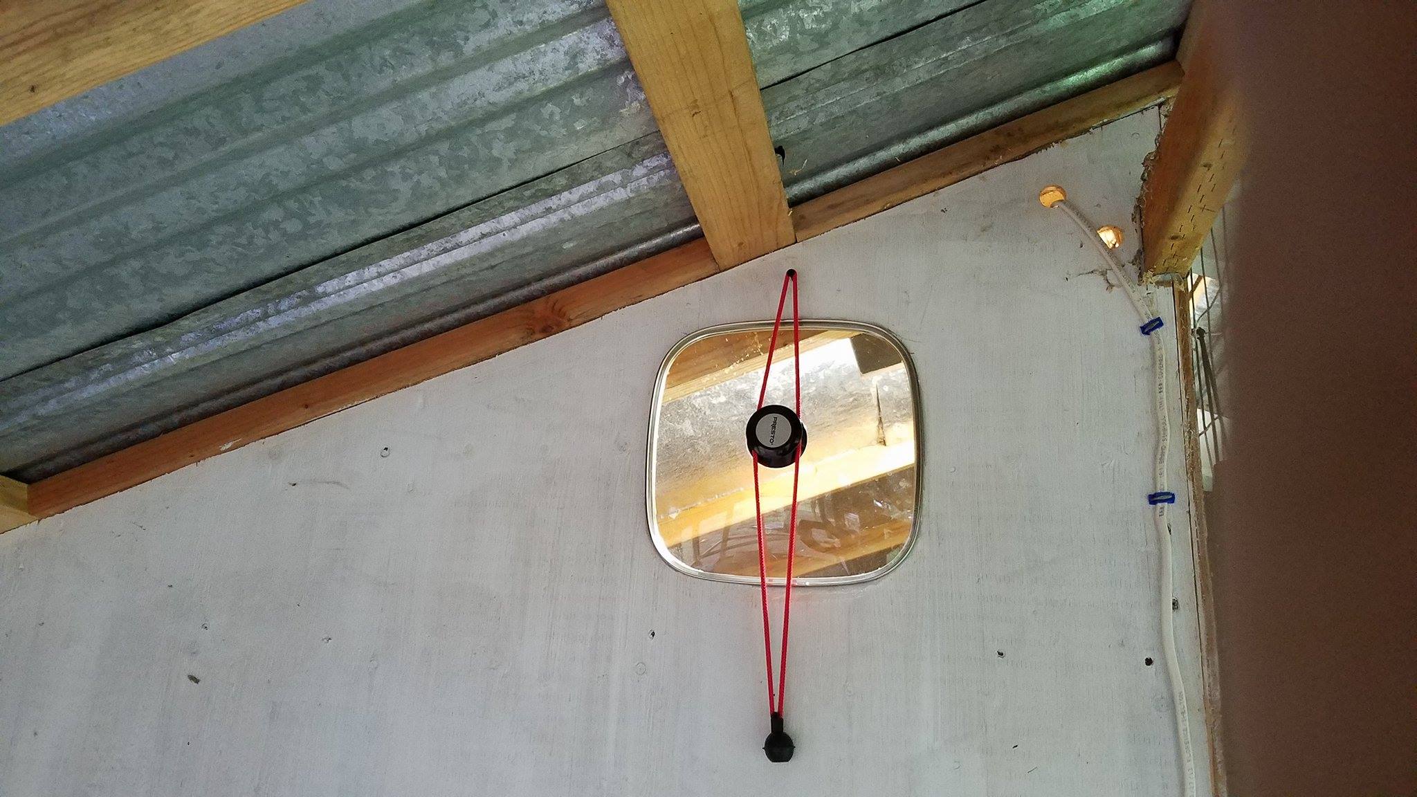 Saw this on another member's coop, awesome idea! This is right next to the light we have in the coop and illuminates the enclosed run in the early winter mornings.