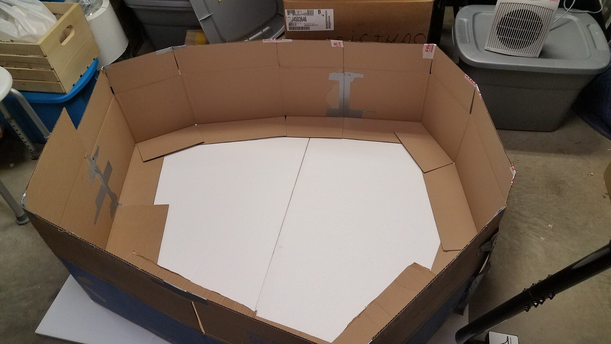 Self-made brooder: Cardbord boxes, Strofoam covered with a Tarp
