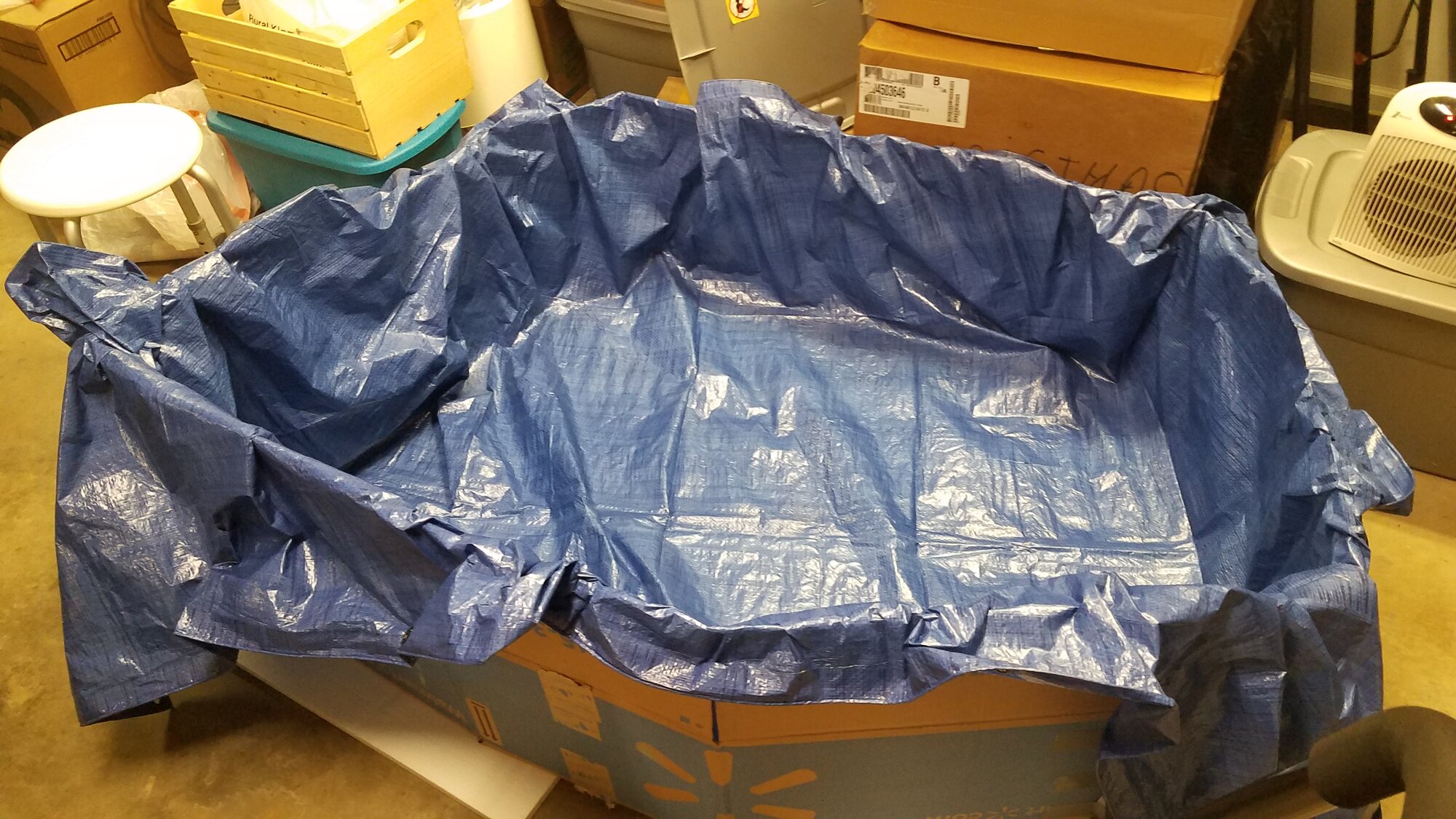 Self-made brooder: Cardbord boxes, Strofoam covered with a Tarp