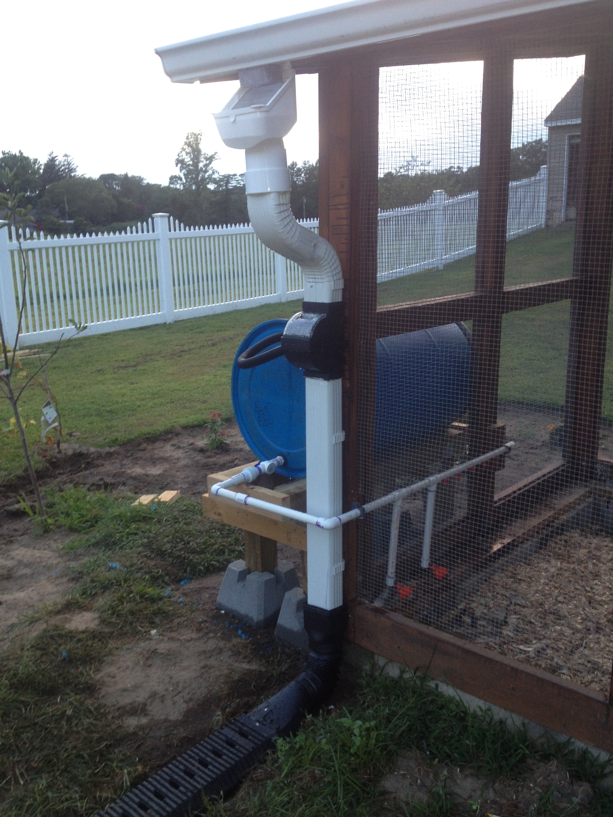 Side view of completed rain barrel watering system