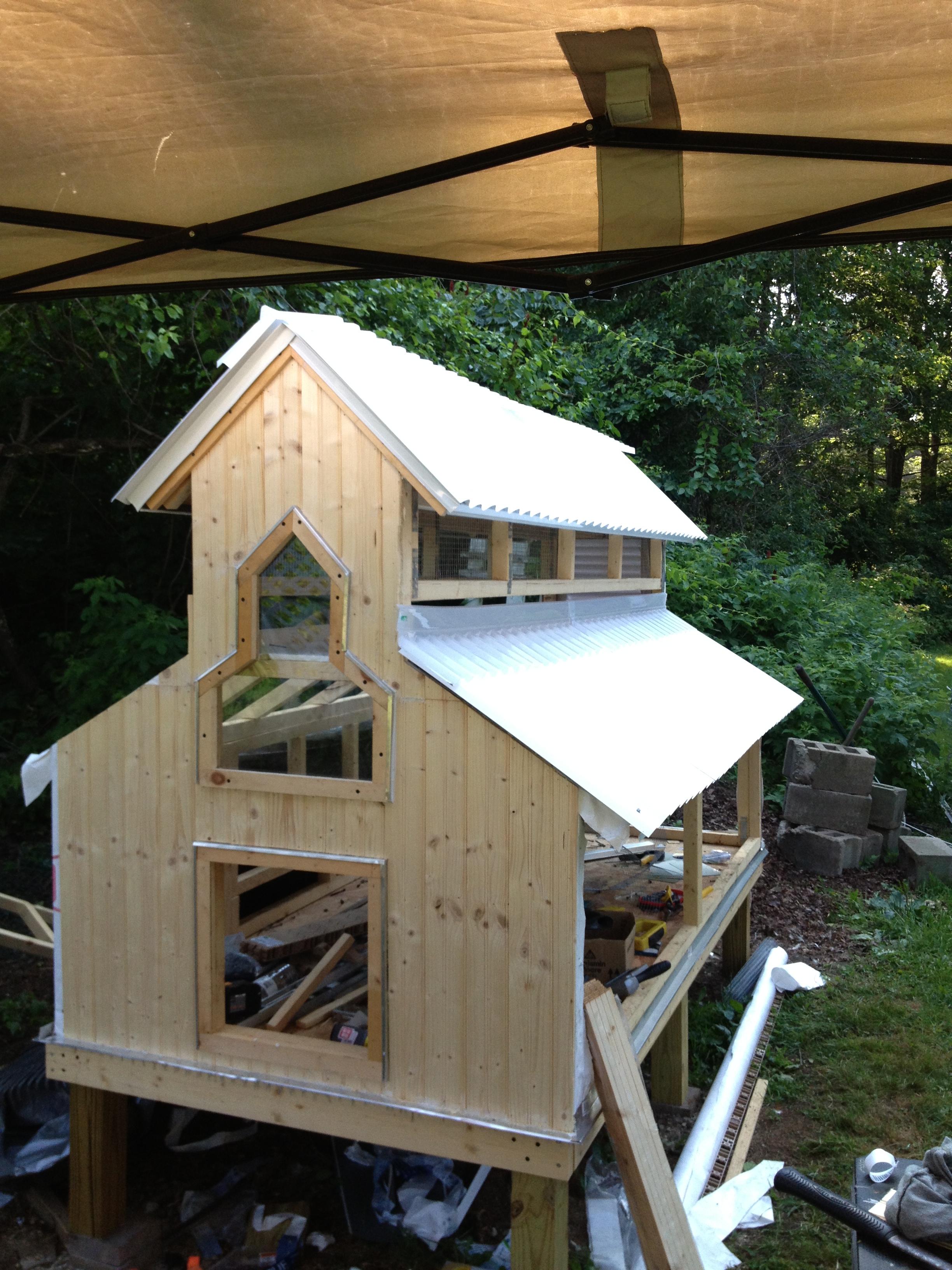 Siding going one and roofing installed.