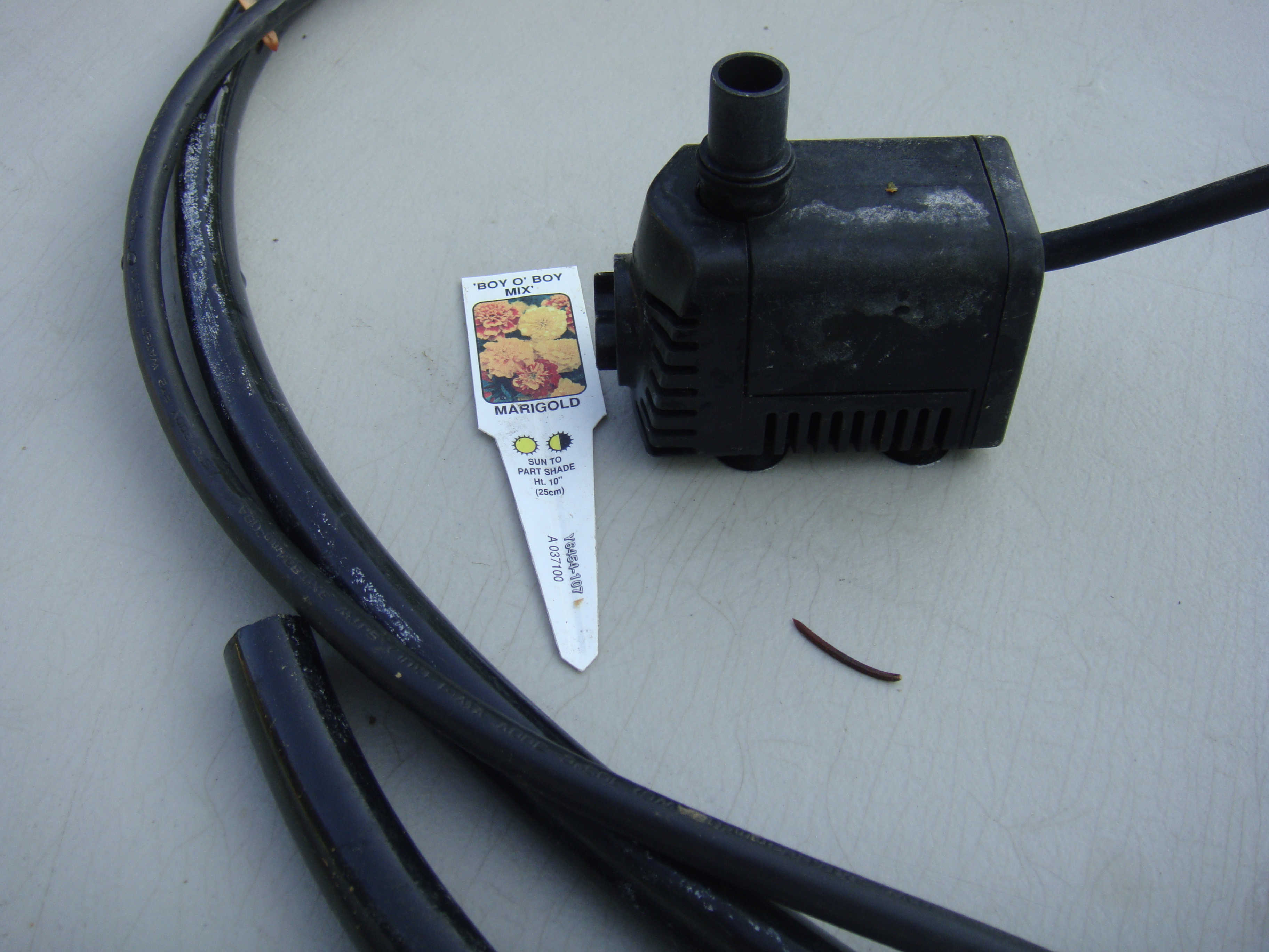 SMALL PUMP FOR  FOUNTAIN  about 50 gal /hr max and has max lift opf only 2-3 ft.
About  $20.00 @ Lowe's