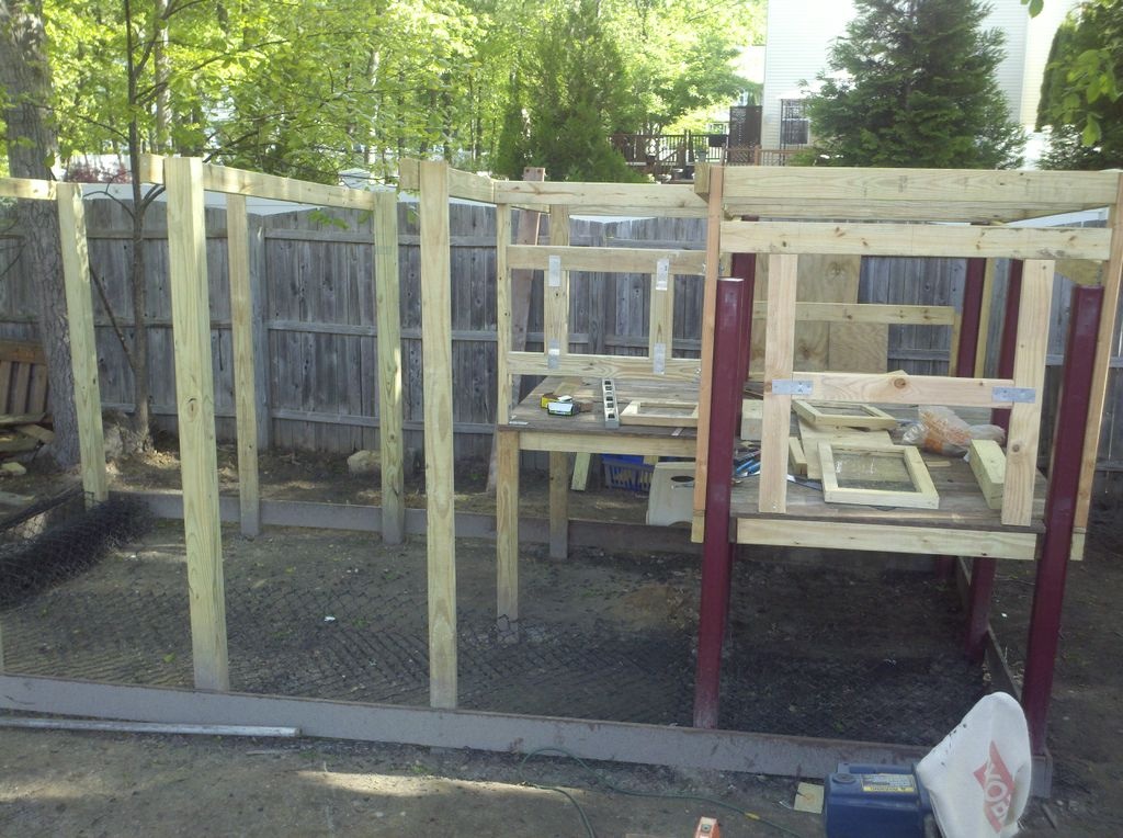 Spaced vertical beams 3 feet apart, pitched the front of the coop and run to 7ft high.  Sunk the back beams into the ground 6 ft high.

Installed black galvanized fence wire on the floor so nothing digs its way in, and then installed border around base to keep floor secure and to provide depth for the deep litter method.