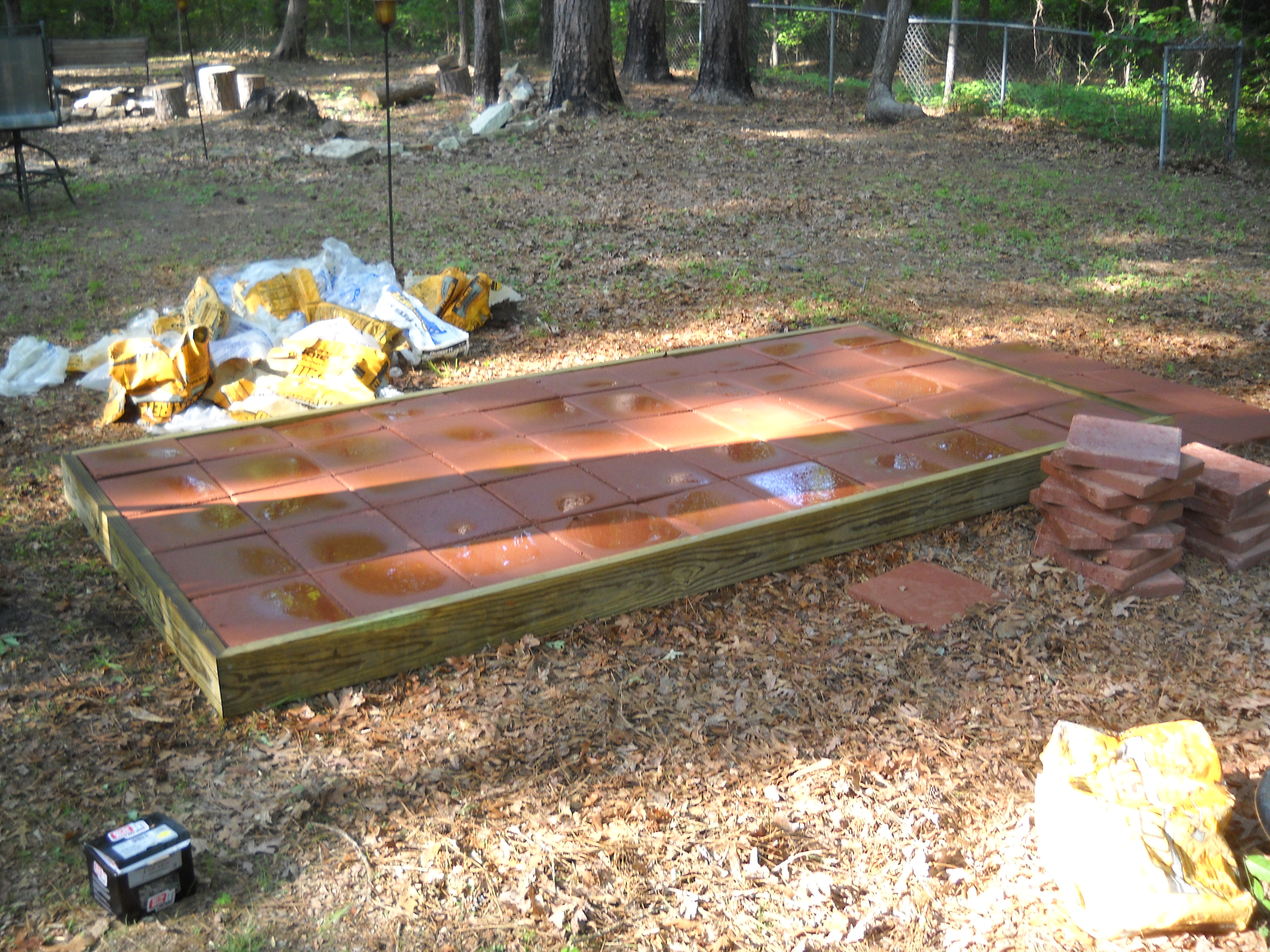 Spray everything off with a hose to activate the portland cement, and take the rest fo the day off. :-)