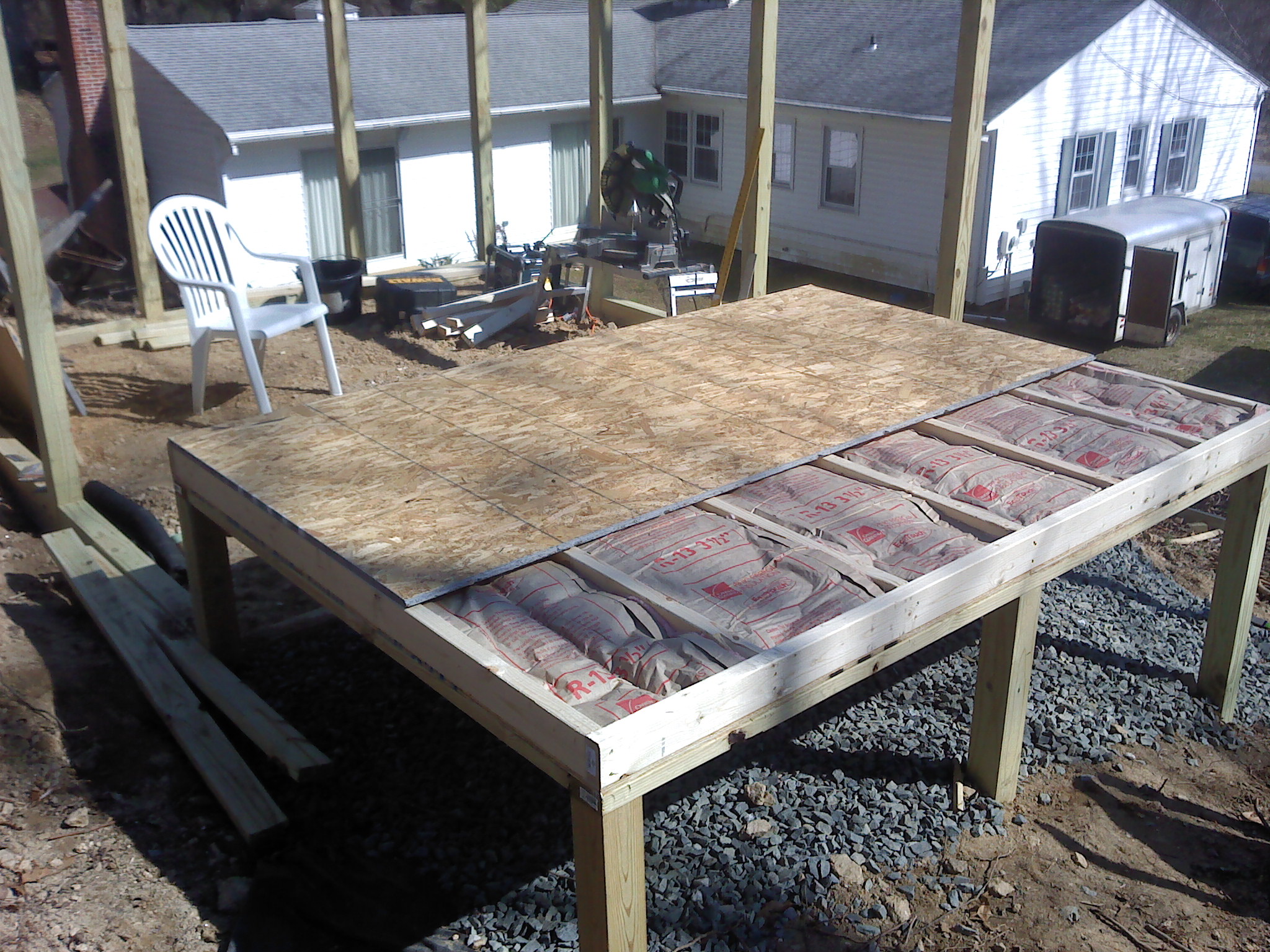 Started on coop. Added insulation to the floor. You can see how high up on the hill it is located. Bringing up materials from the back yard was back breaking.