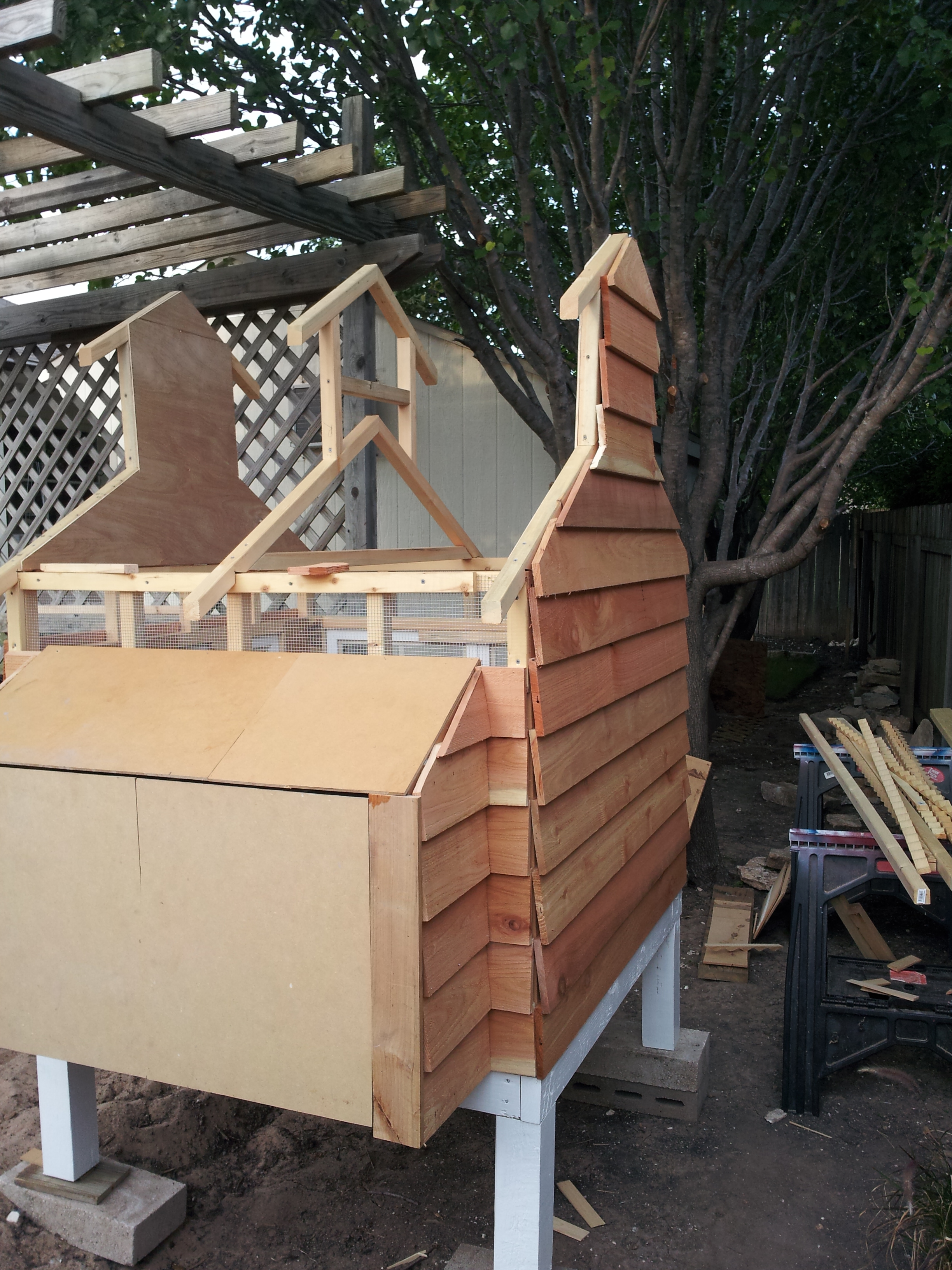 Starting the siding, made changes to the nesting box.  You can see the vents under the eaves.