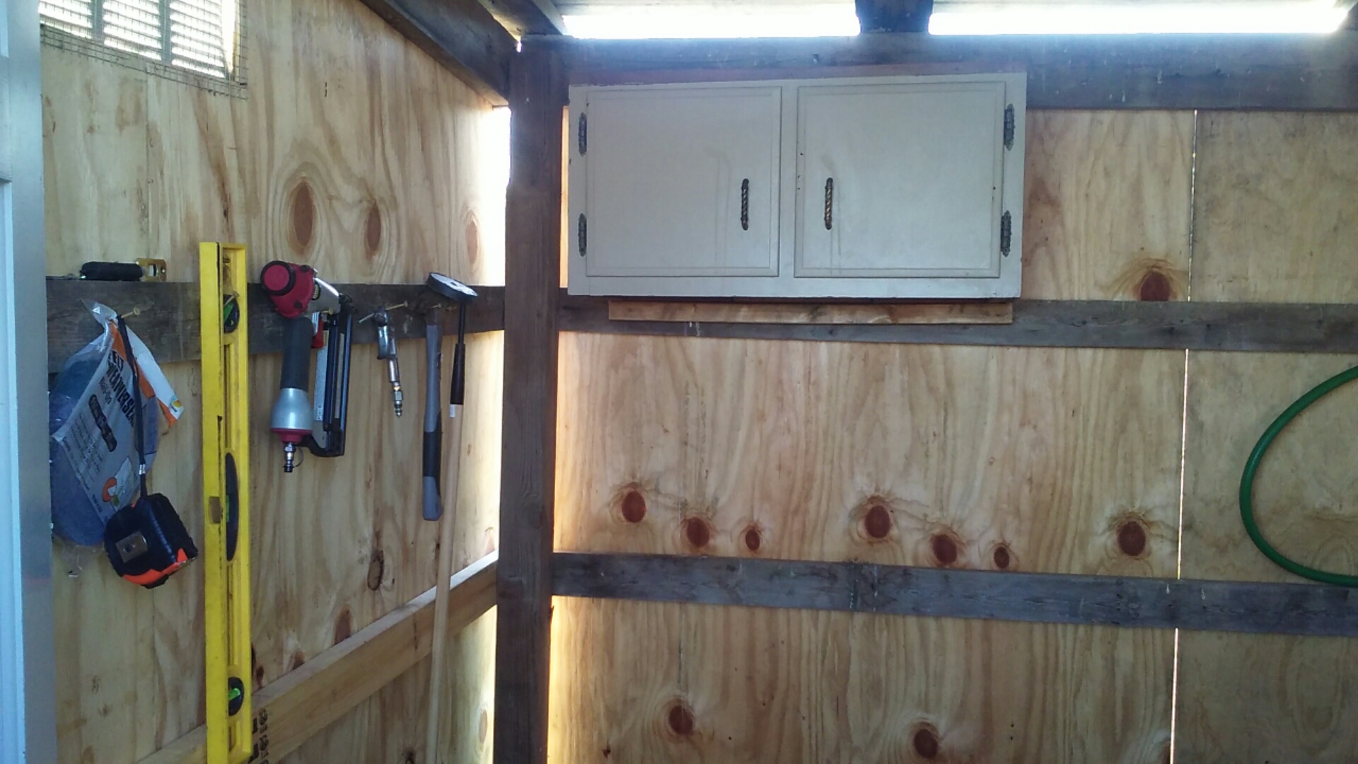 Storage area early on. Cabinet replaced with bigger one. Much love for free items on Craigslist and the ReStore for secondhand materials.