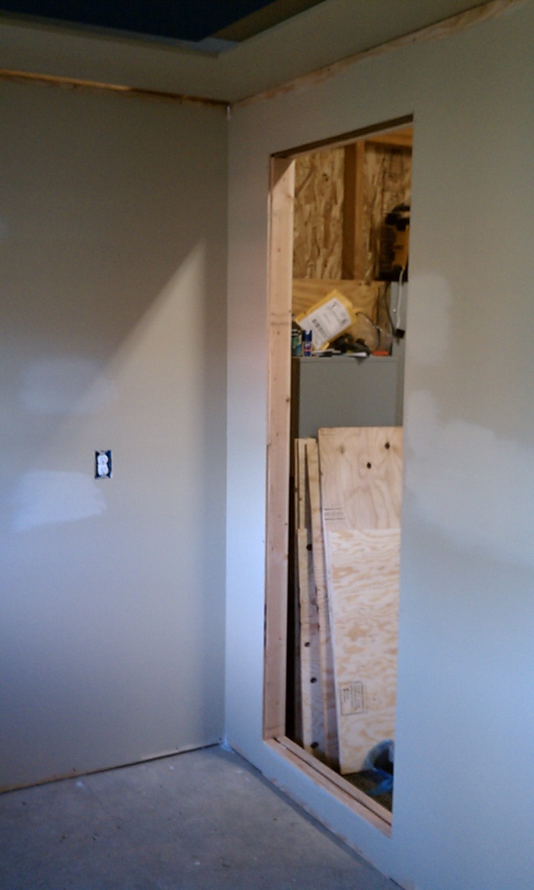 Struggling to get a good picture inside.. I still need to install the overhead lights.

The patches of lighter colored paint is actually a primer.  I filled in a few voids that I missed the first time around, so I primed them and repainted with the final color. I have trim moldings I will use to hide the gap from the wall to the ceiling.