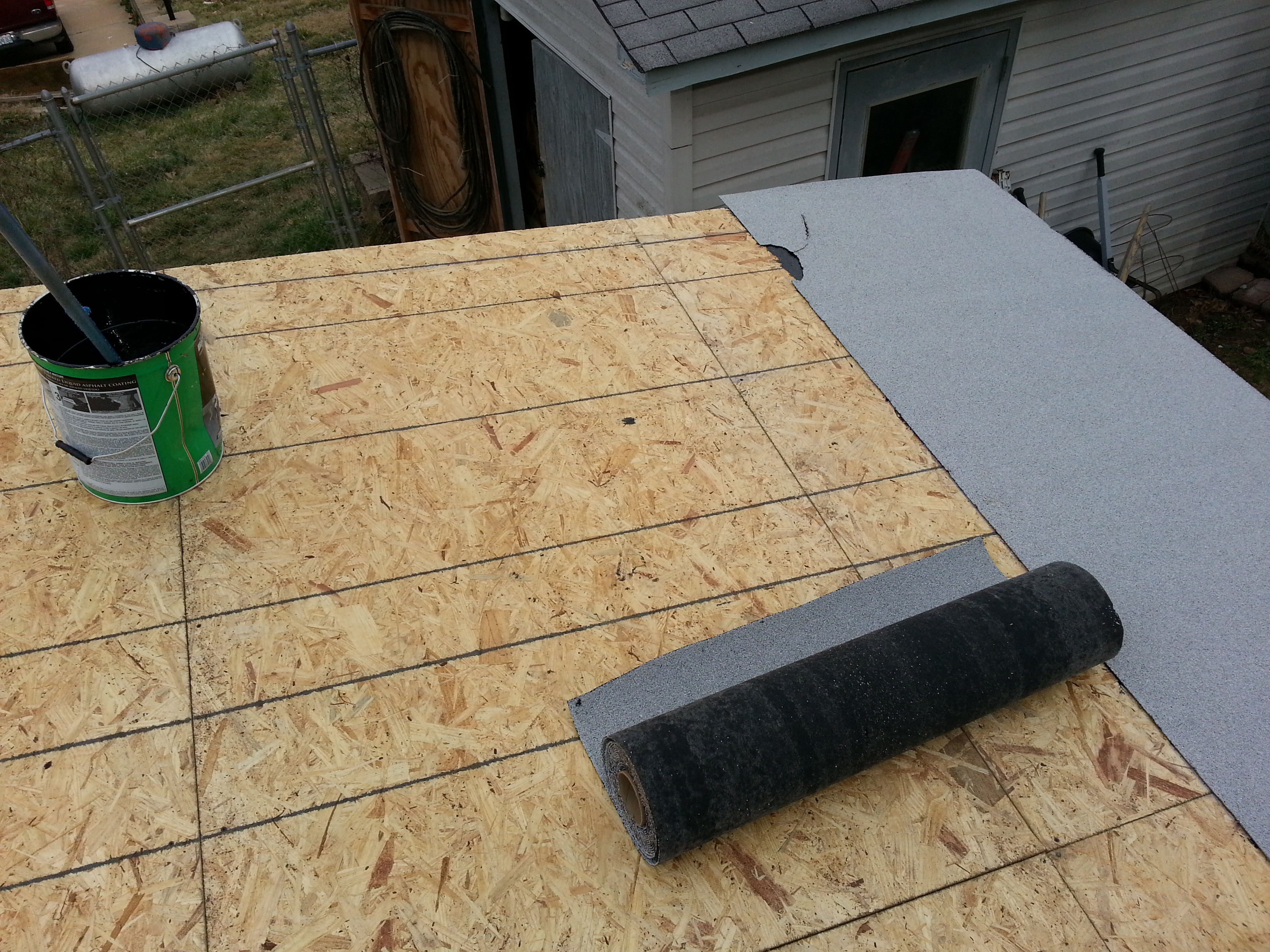 Tared and rolled out white granulated tar paper on top.