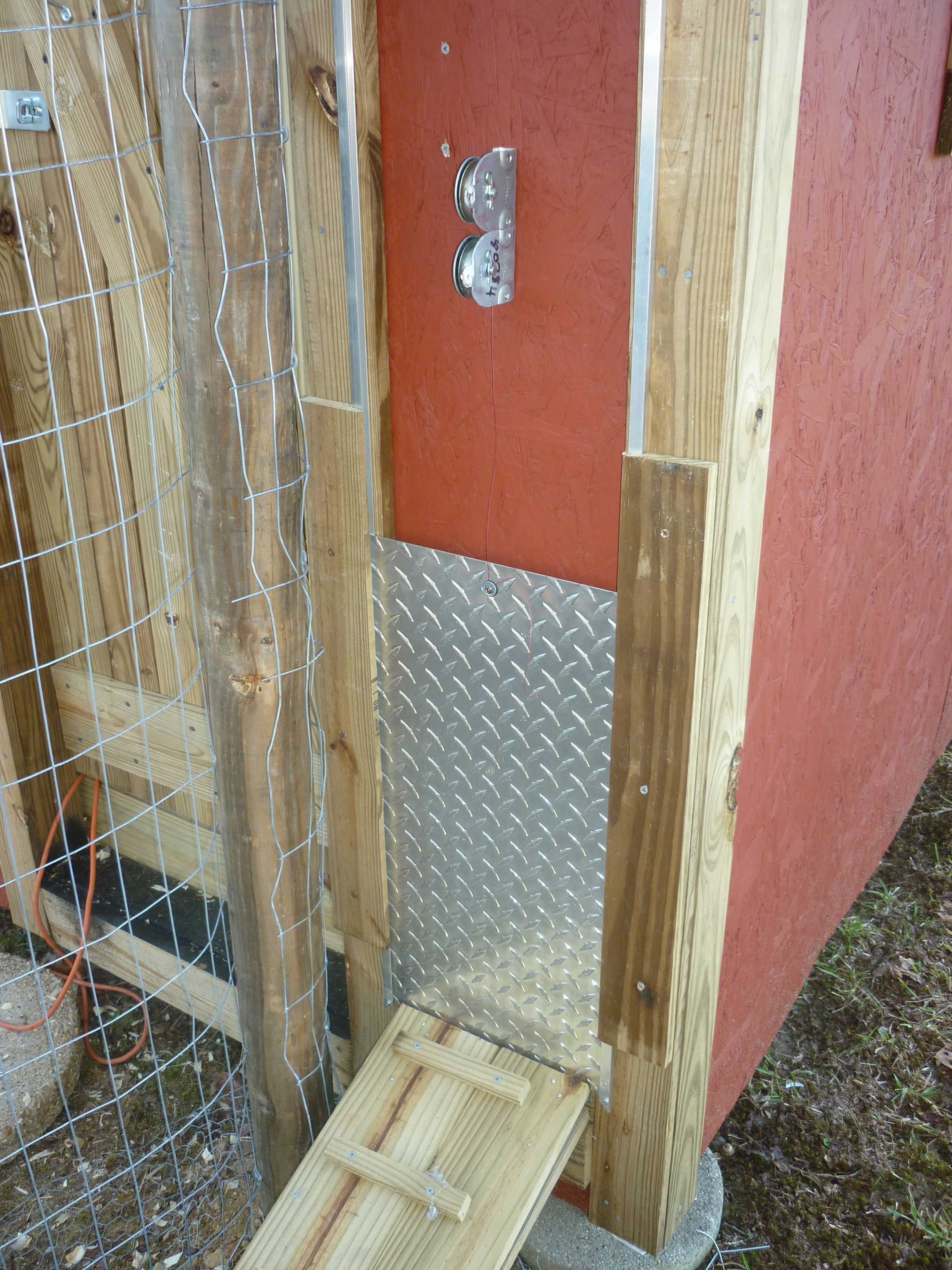 The automatic door; it is on a timer (inside) powered by a solar panel on the roof.  The door is on a pully with heavy-duty line.