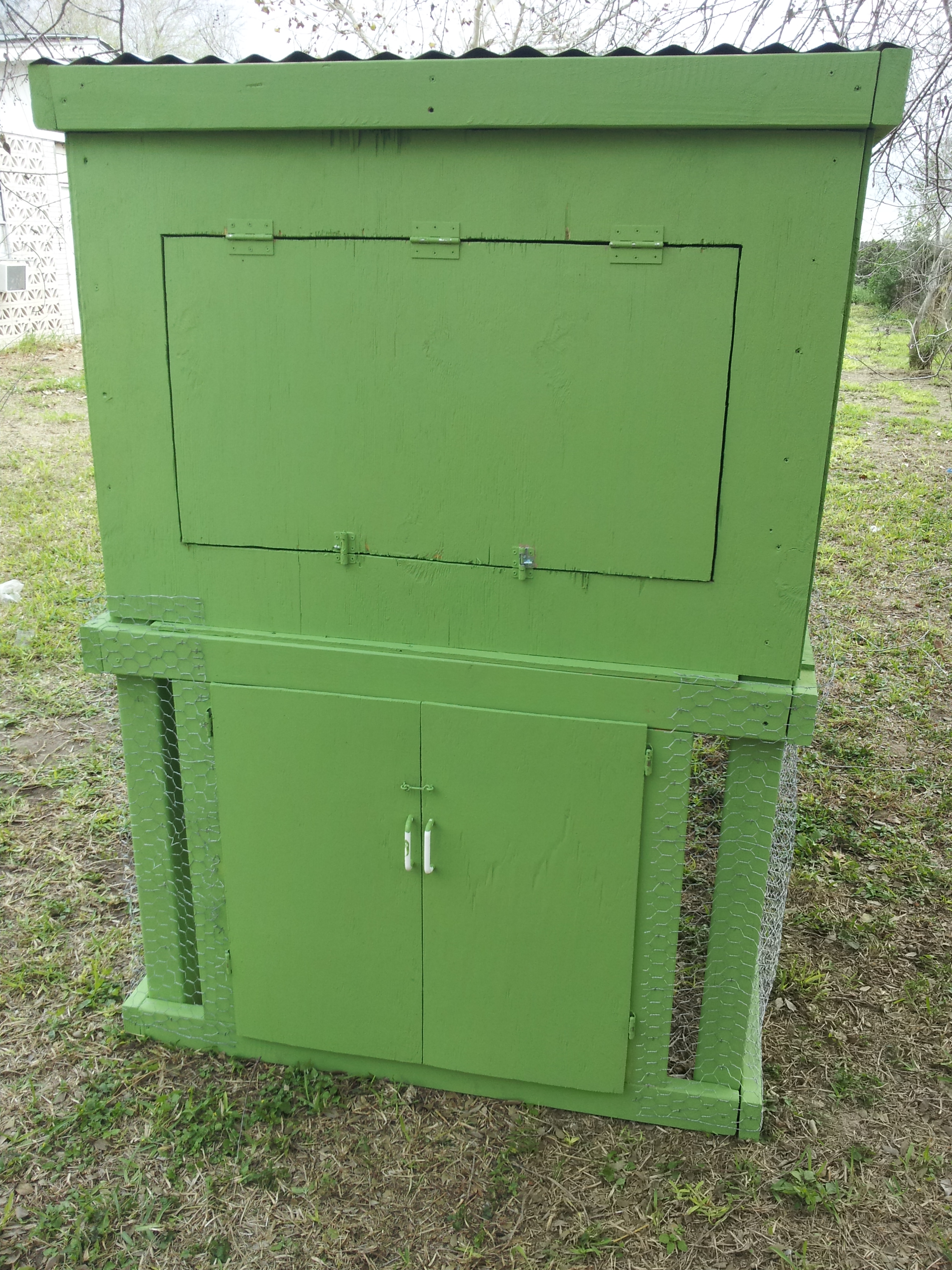 The "back" side of the coop, with main coop access and nesting area access.