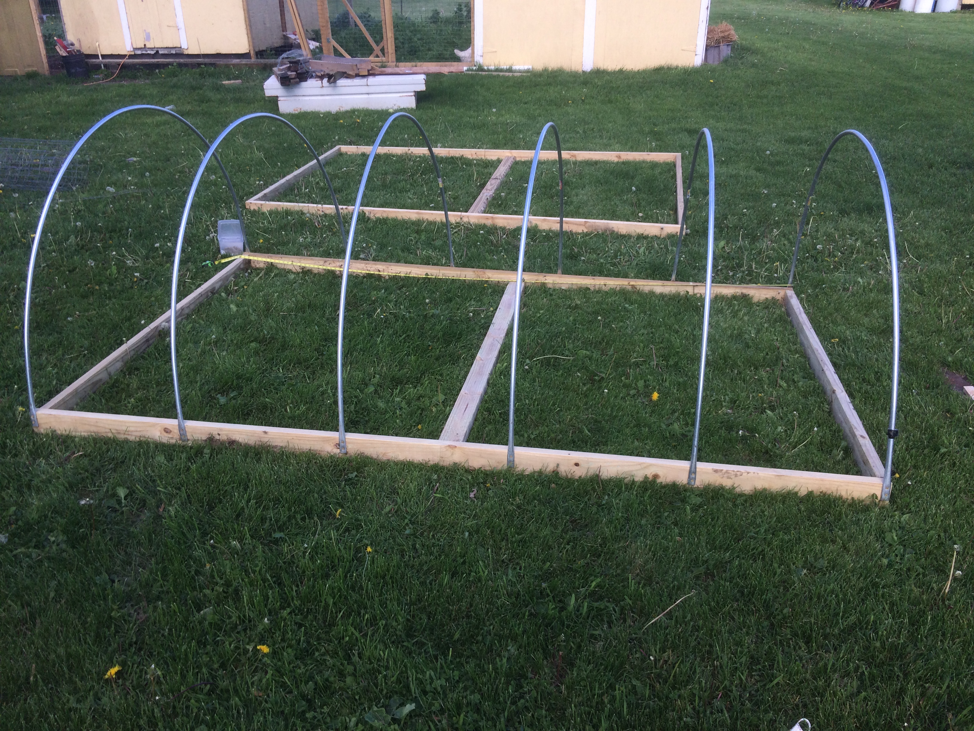 The base with the hoops attached.  They must be exactly 24" on center apart for the hardware cloth to fit.