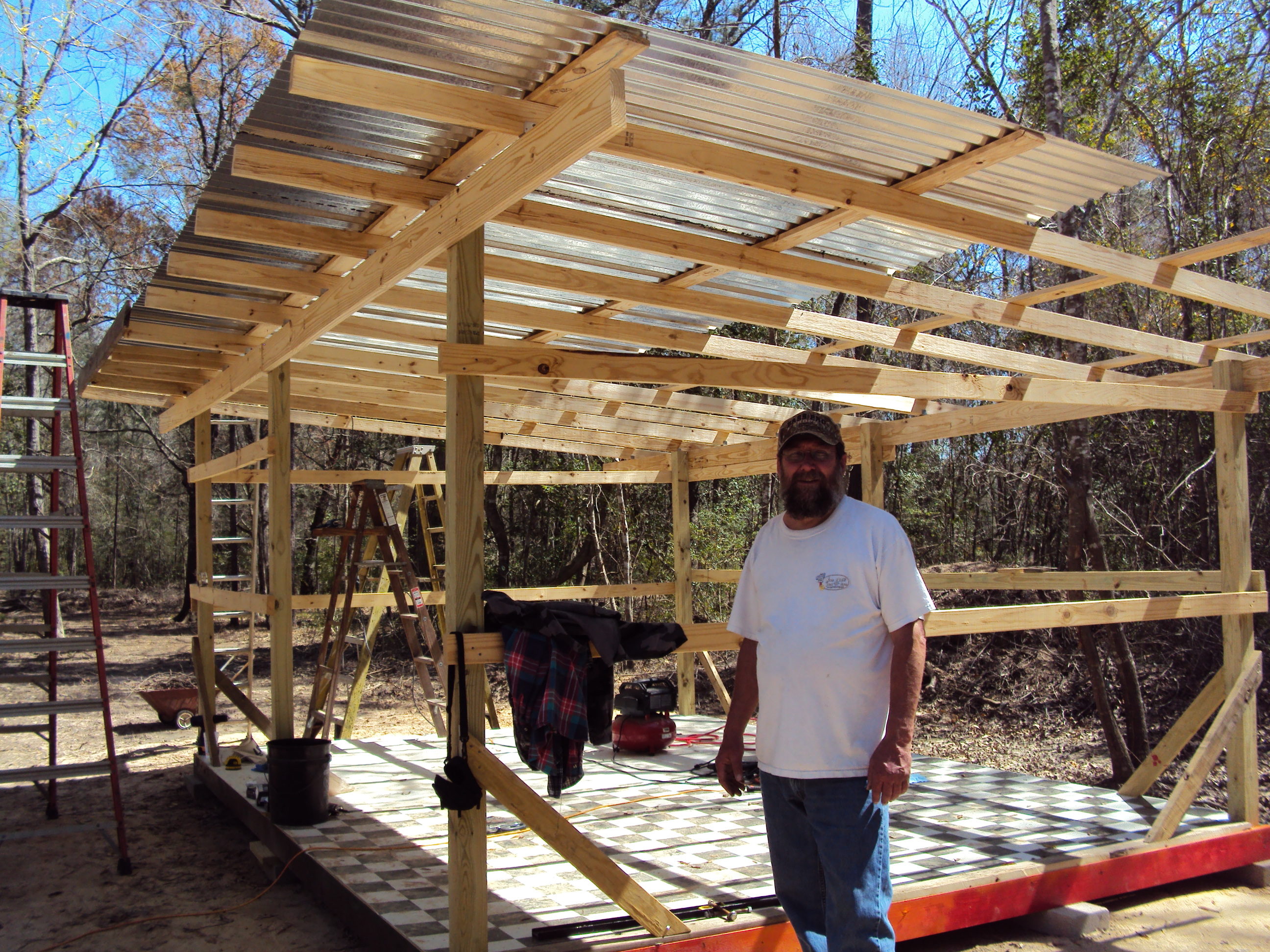 The builder - my hubby Keith - with half of the roof done.