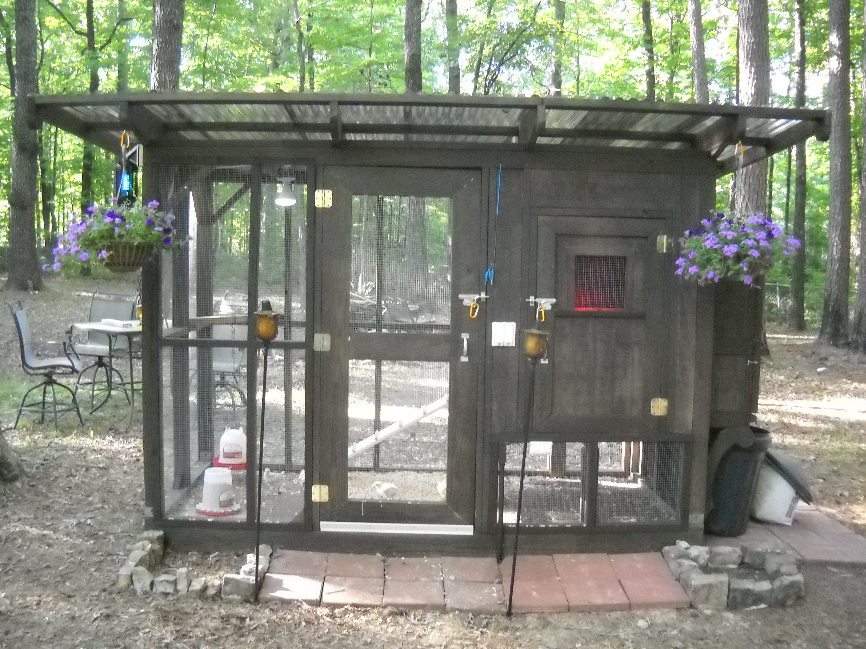 The finished product.  Added some hanging plants, the bug light, and a couple of small flowerbeds.