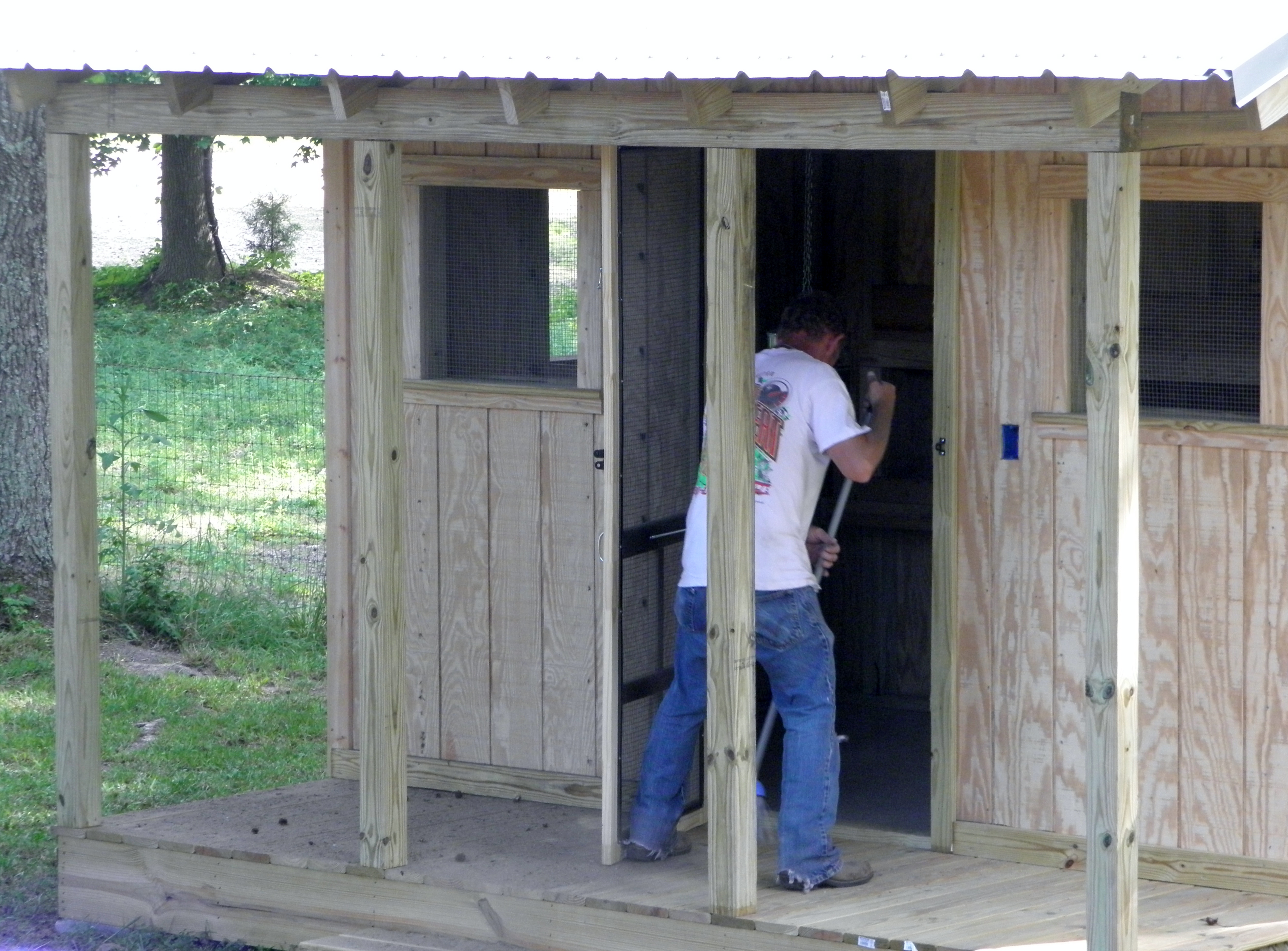 The front door has been set and widows are closed in with wire.