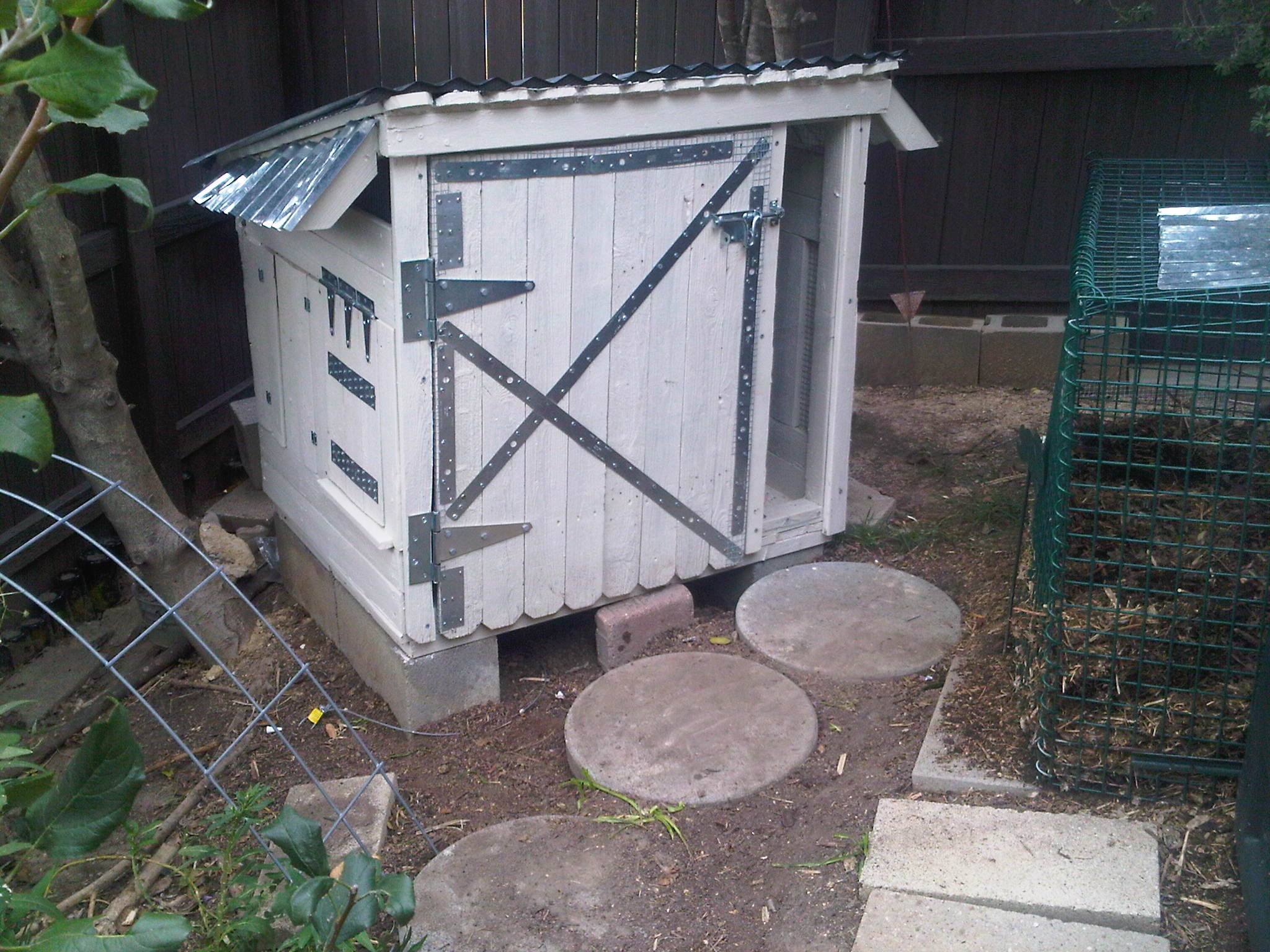 The front door is done. made out of fence slats. There is hardware cloth on the back of it. I put mettal plates on the inside door jam to make sure there is no space large enough for a rat or mouse to get through (hopefully).