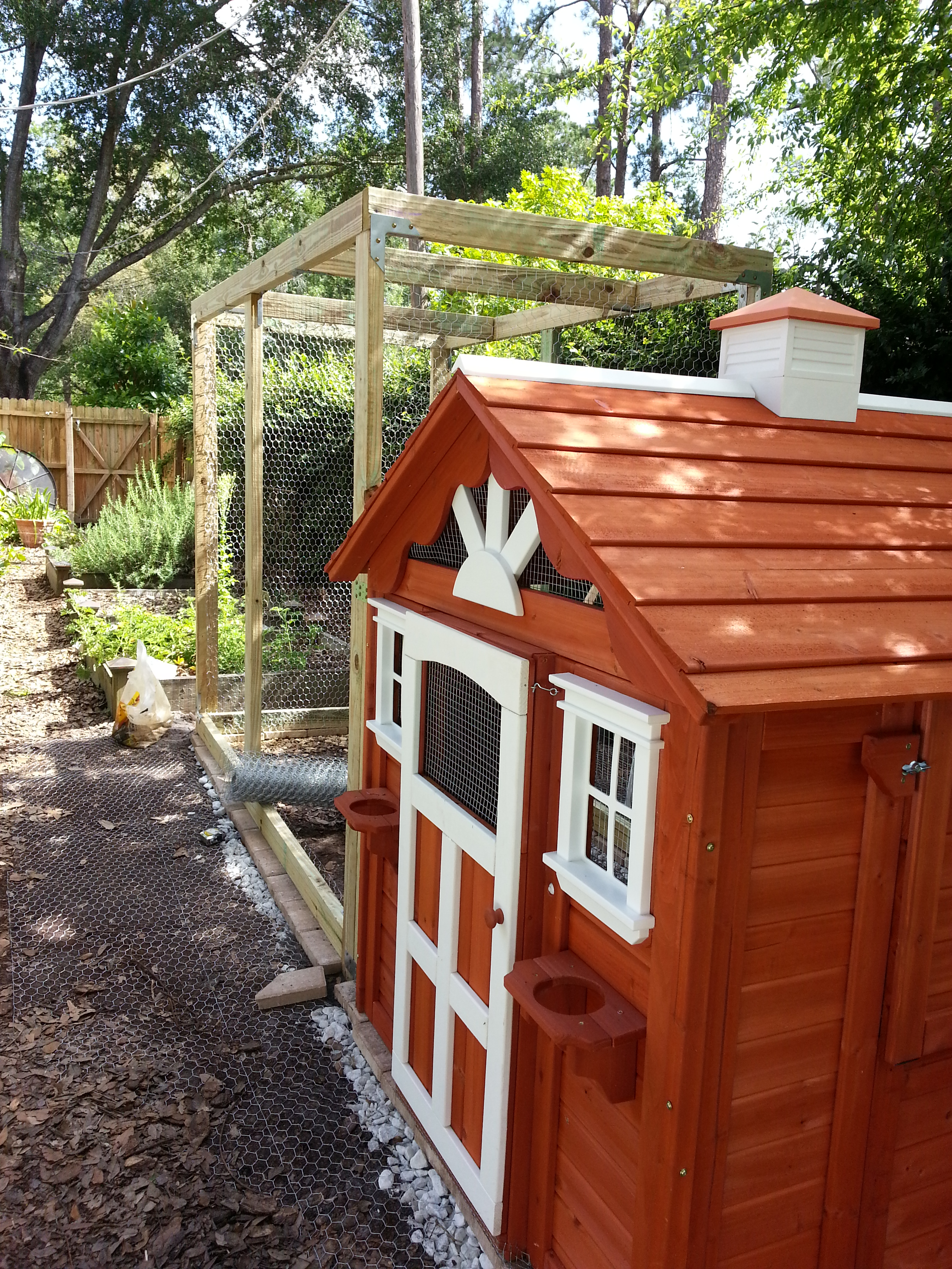 The front of the chicken cottage with flower "boxes" and a door bell!!
