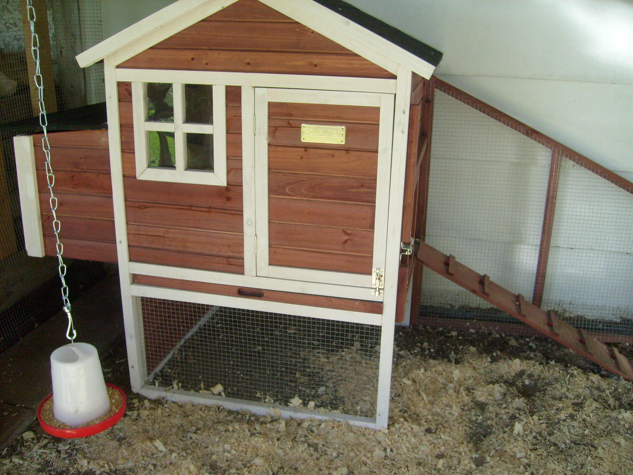 The hens like to sleep in the next box. It is most likely because the roost inside this coop is about 4 inches off the floor. From what I've read on this website, the roost should be alot higher than that.  It's been really cold at night this November, so they huddle in the nest box to keep warmer I'm sure.