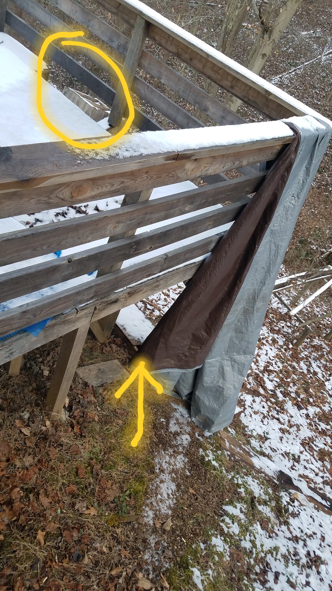 The hole in the floor and the floor boards on the ground