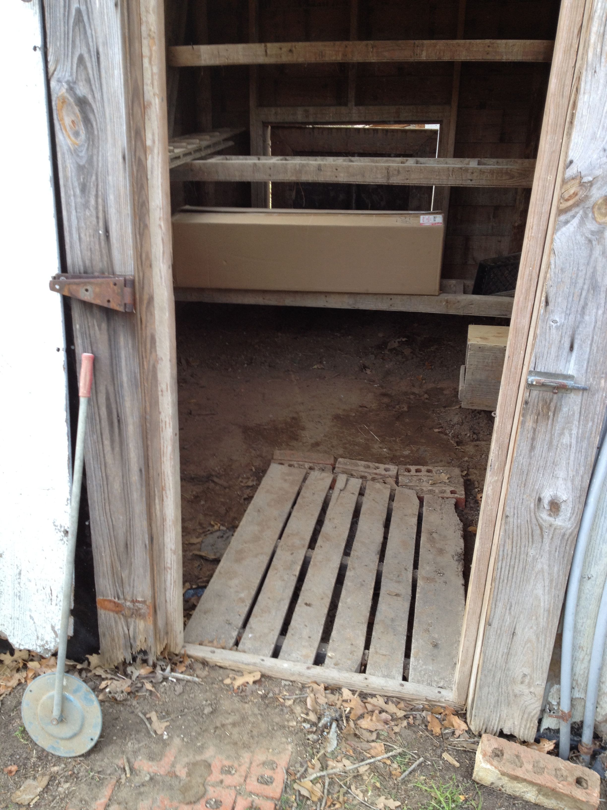 The (human) entrance to the coop. The box sitting on the lower roost in back contains two florescent light fixtures (2x4' tubes apiece). I have the materials to build the door using 1x6 frame and smart siding.