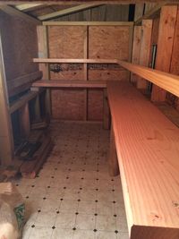 The inside of the 8x4ft coop 90% finished. Lined the floor with linoleum. The 3 nest boxes can be seen on the left. We have 12 pullets so I'm hoping this will be enough. The roosting bar is placed 10" out from the coop wall and runs 8' long on the side wall and almost 4' across on the back wall, giving almost 12' of roosting space for the 12 girls. It was tough trying to figure out a good configuration for enough roosting space in there! The poop board sits 24" off the floor and the roosting bar is 30" off the floor.