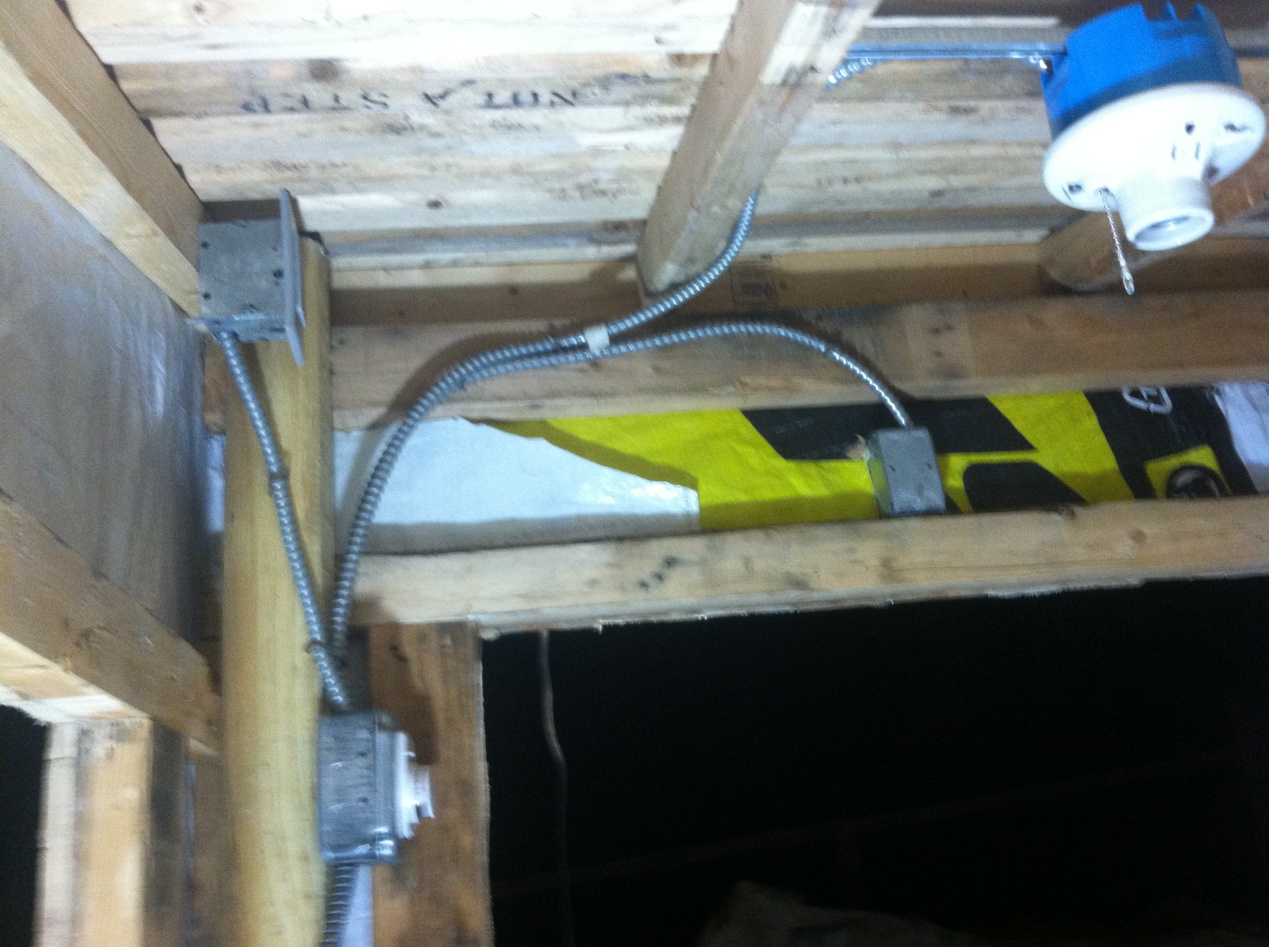 The interior light is on a timer and there is a GFCI tucked up in the corner,  The outside light is on a motion sensor.  All of the romex was from a demo site I was working on.  All I needed to purchase was the motion sensor light and the ceiling junction box.